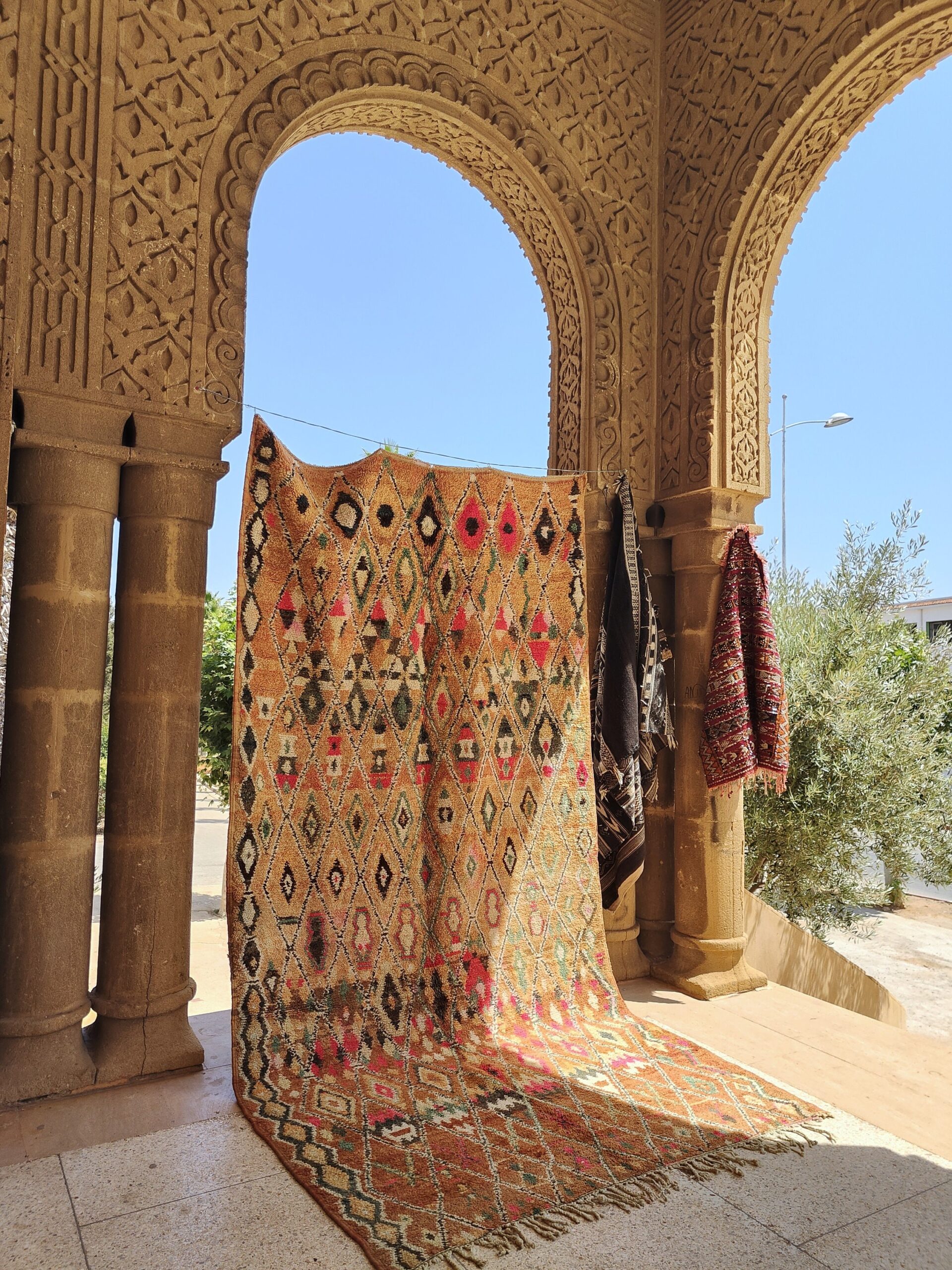a large rug is on display in a building. il_fullxfull.6023115658_hluw.jpg