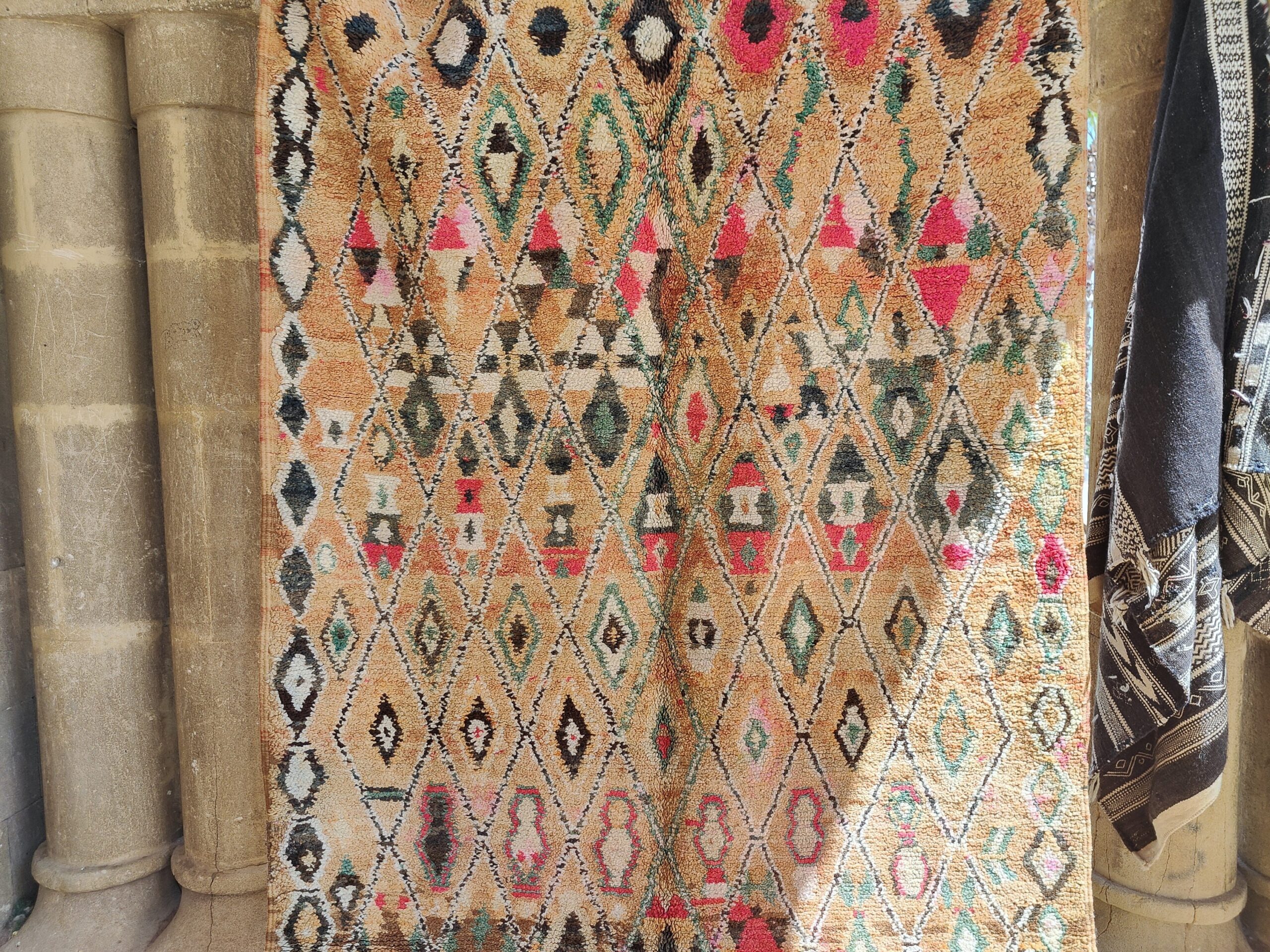 a rug hanging on a wall. il_fullxfull.6023115698_jfd7.jpg