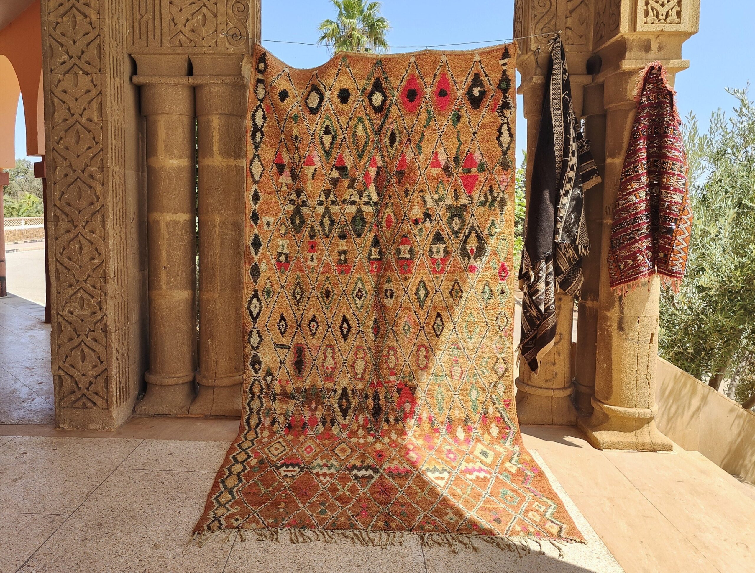 a colorful rug is on display in a room. il_fullxfull.6023117414_n2al.jpg