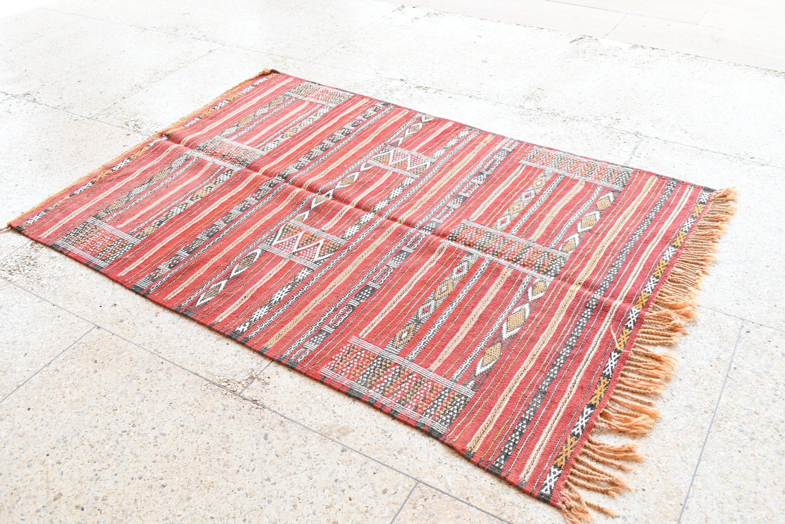 a red rug with a pattern on it. il_fullxfull.6025853794_njo3.jpg