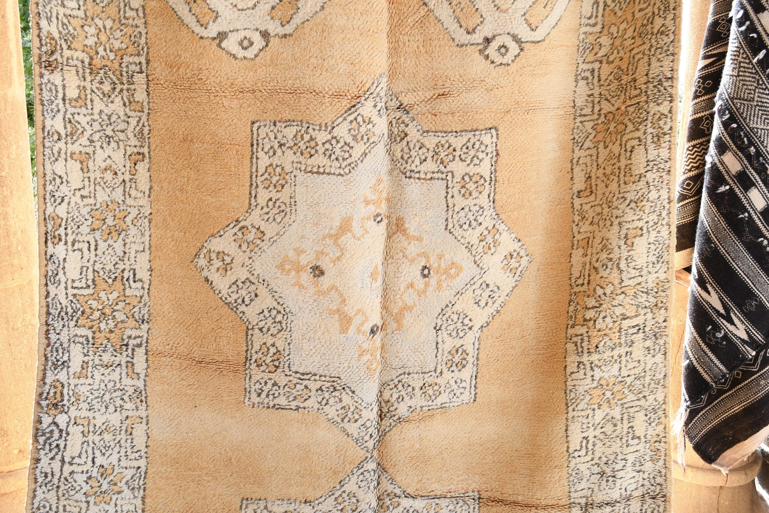 a rug hanging on a wall. il_fullxfull.6025856880_r7um.jpg