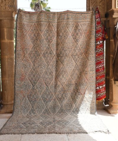 a rug hanging on a wall in a room. il_fullxfull.6025858770_dl9x.jpg