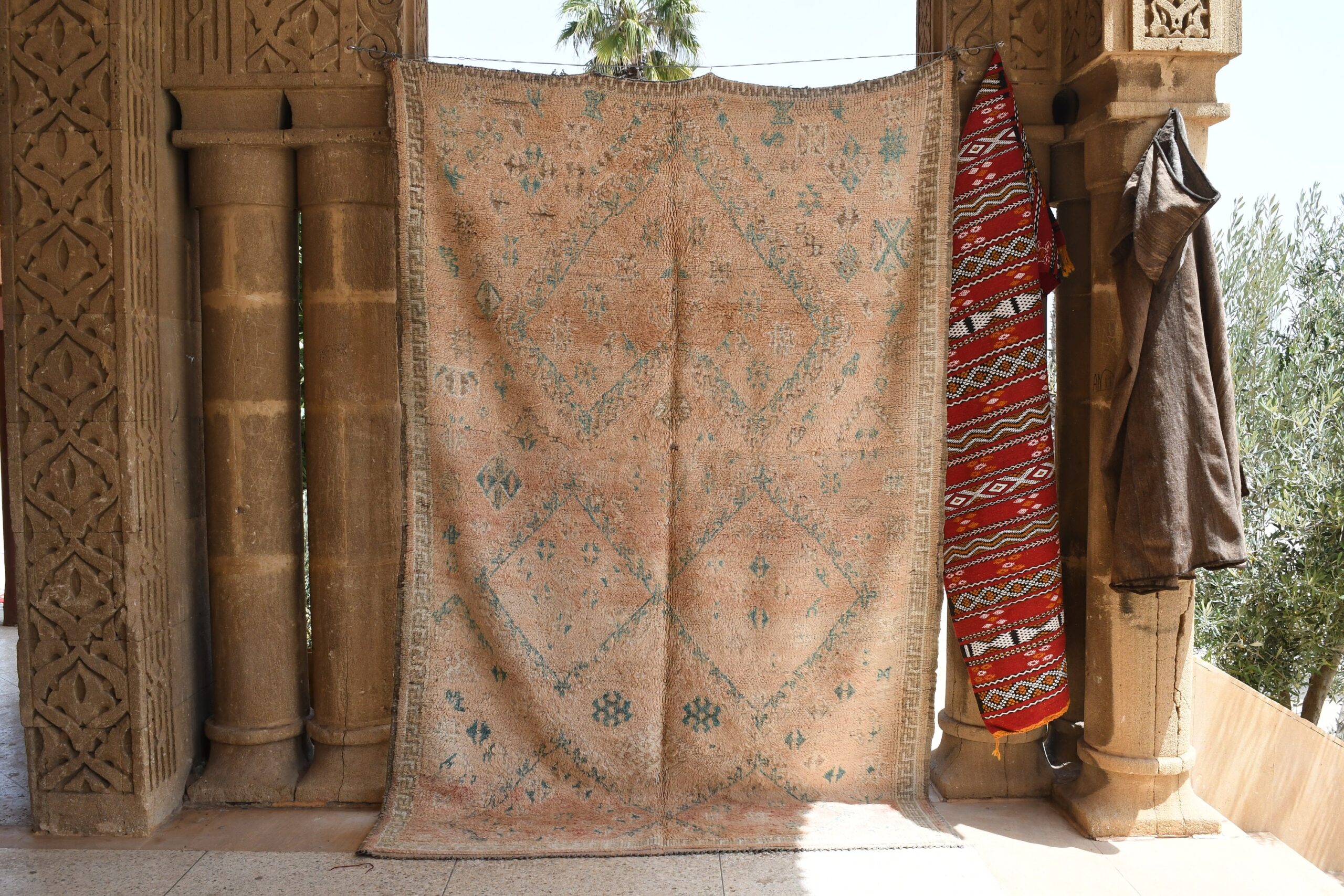 a moroccan rug hanging on a wall in a room. il_fullxfull.6025866930_kf8q.jpg