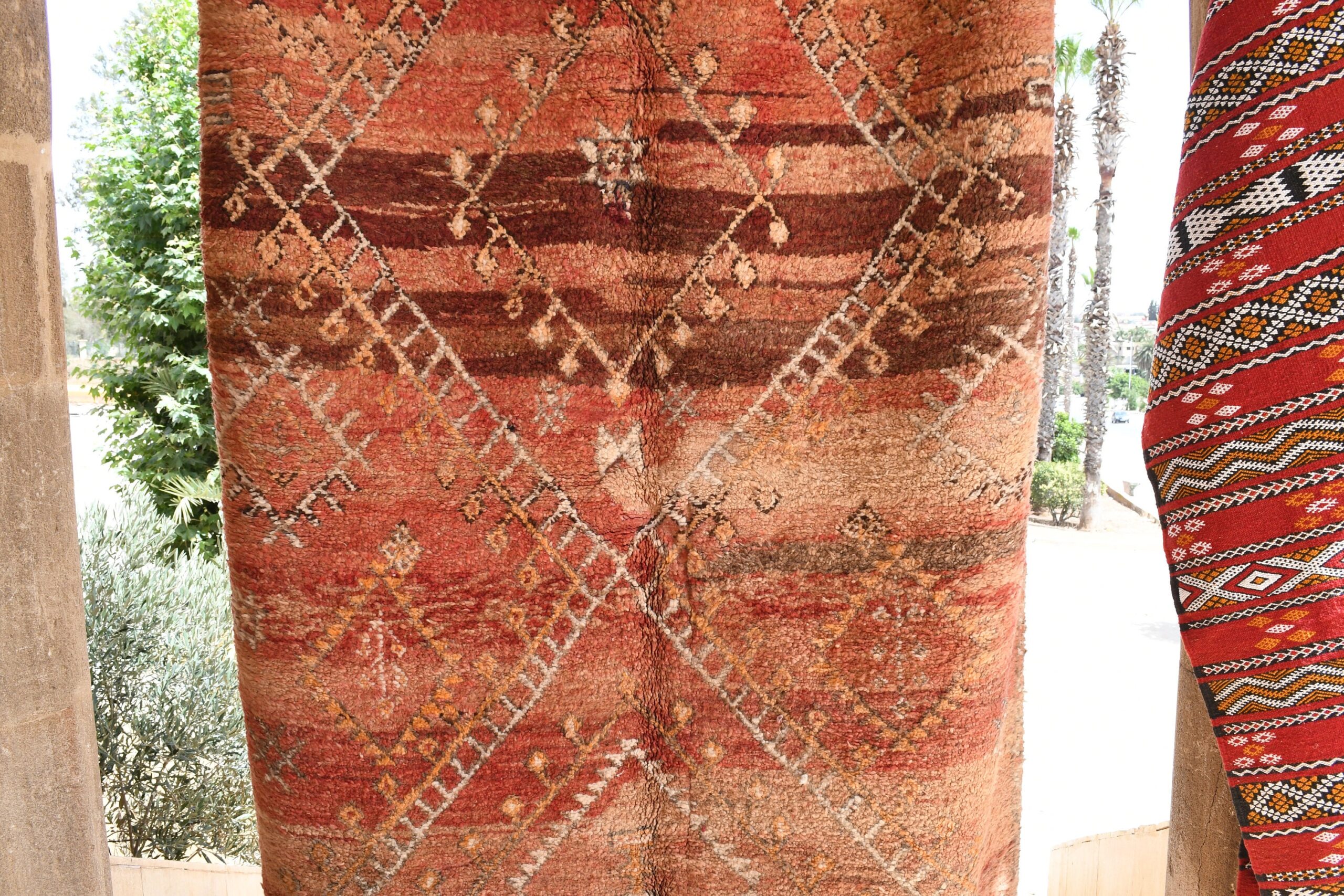 a red and brown rug with a pattern on it. il_fullxfull.6025873330_iiau.jpg