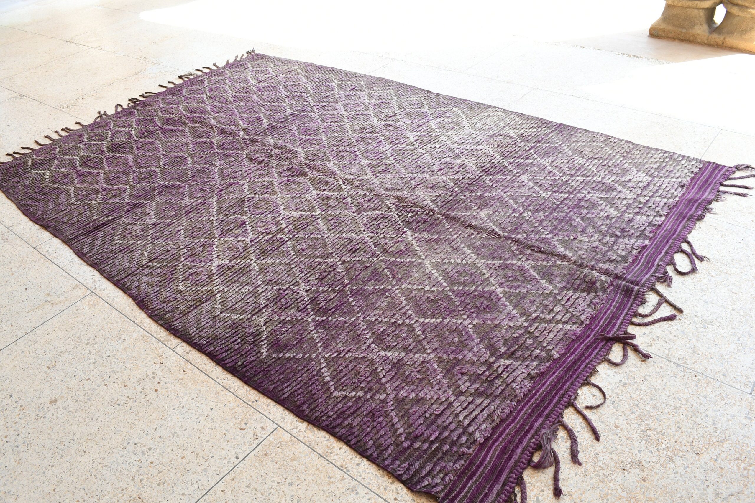 a purple rug with fringes on the floor. il_fullxfull.6025888948_nfez.jpg