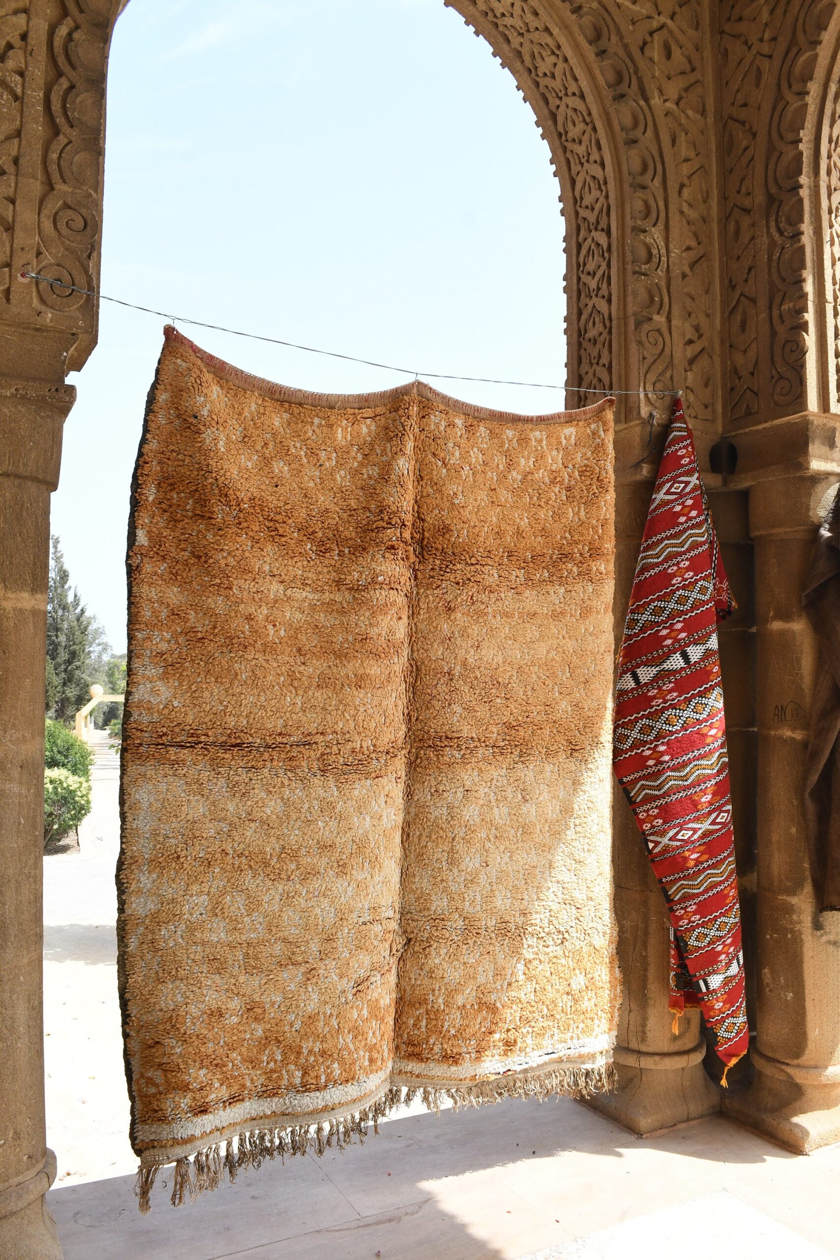 a man is standing in a doorway with a rug. il_fullxfull.6025890930_hfvh.jpg