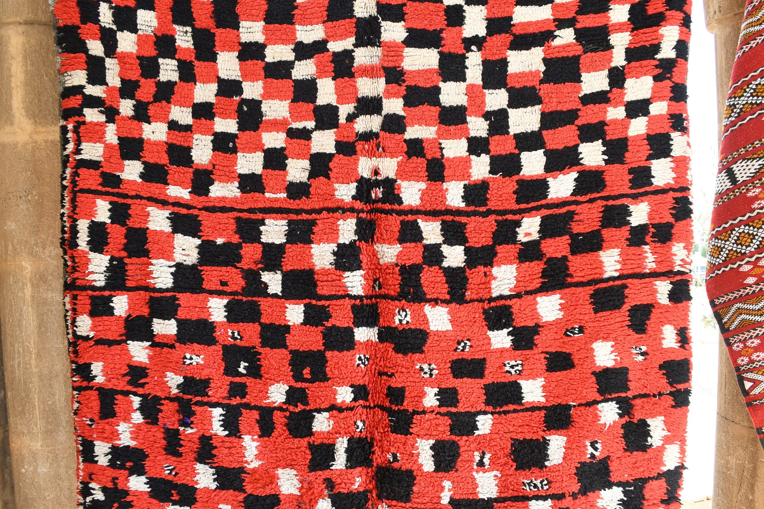 a red and black rug with a pattern on it. il_fullxfull.6025906866_r7ya.jpg