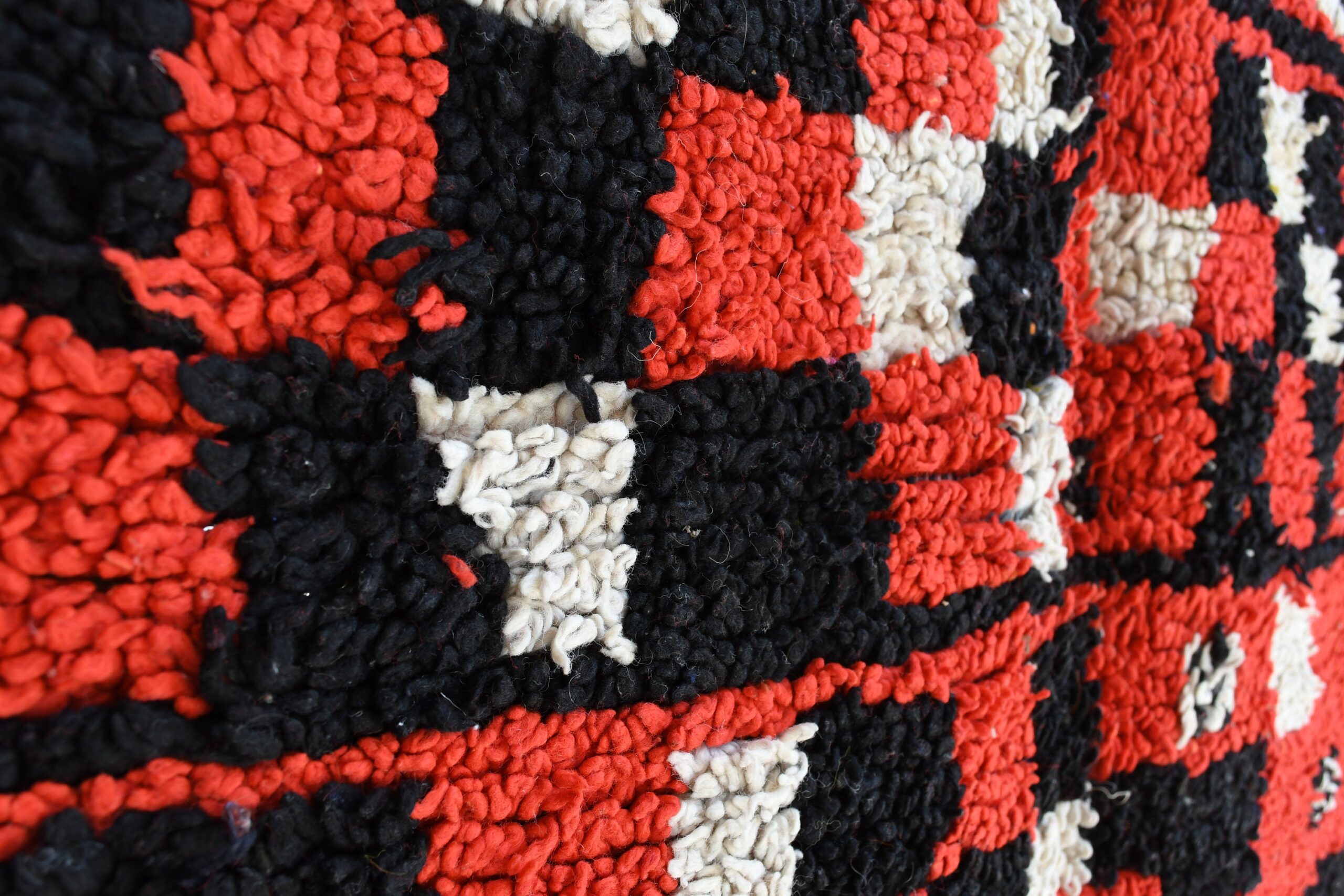 a close up of a red and black rug. il_fullxfull.6025907462_ju5d.jpg