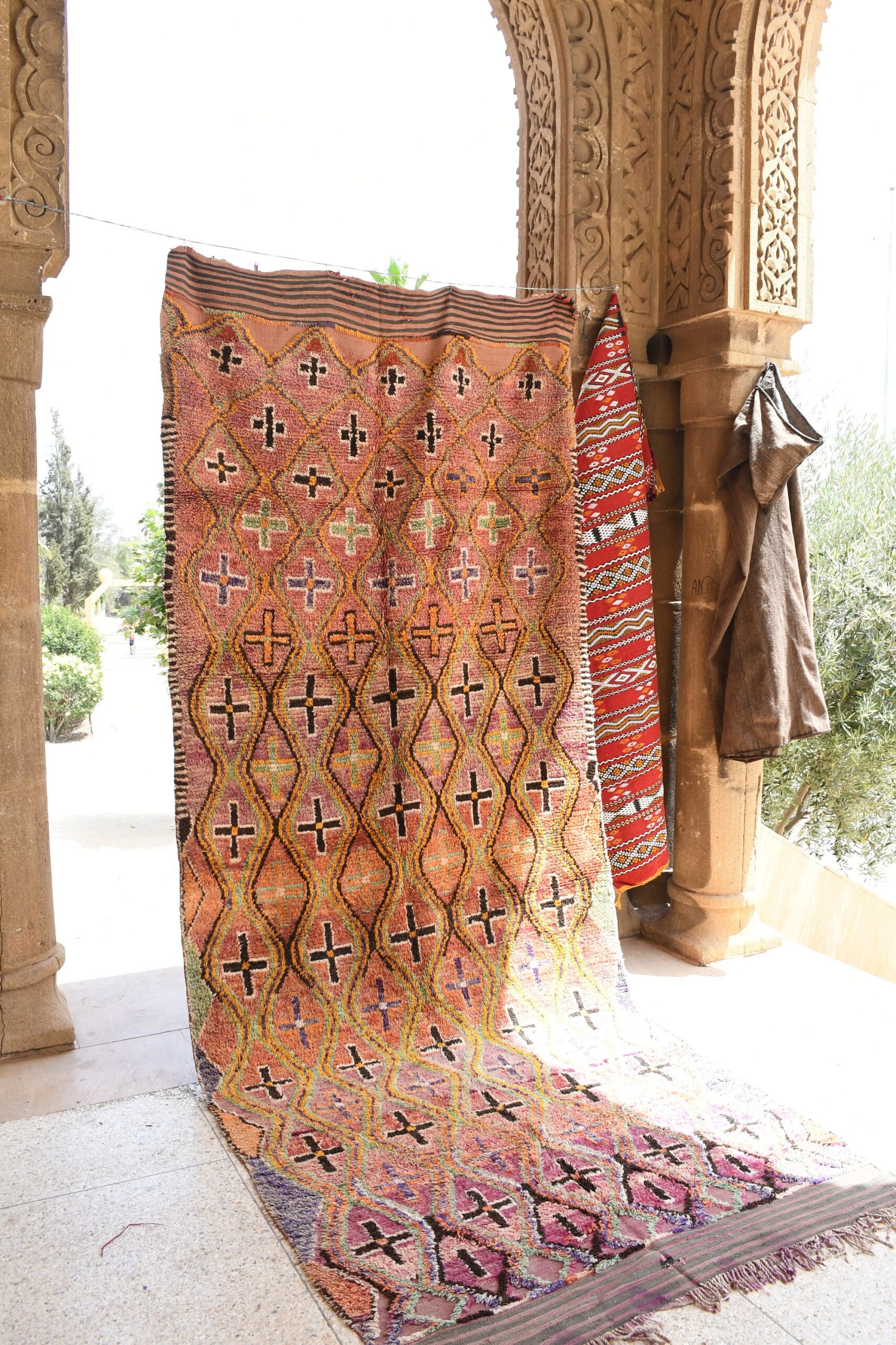 a colorful rug is on display in a room. il_fullxfull.6025908956_thri.jpg