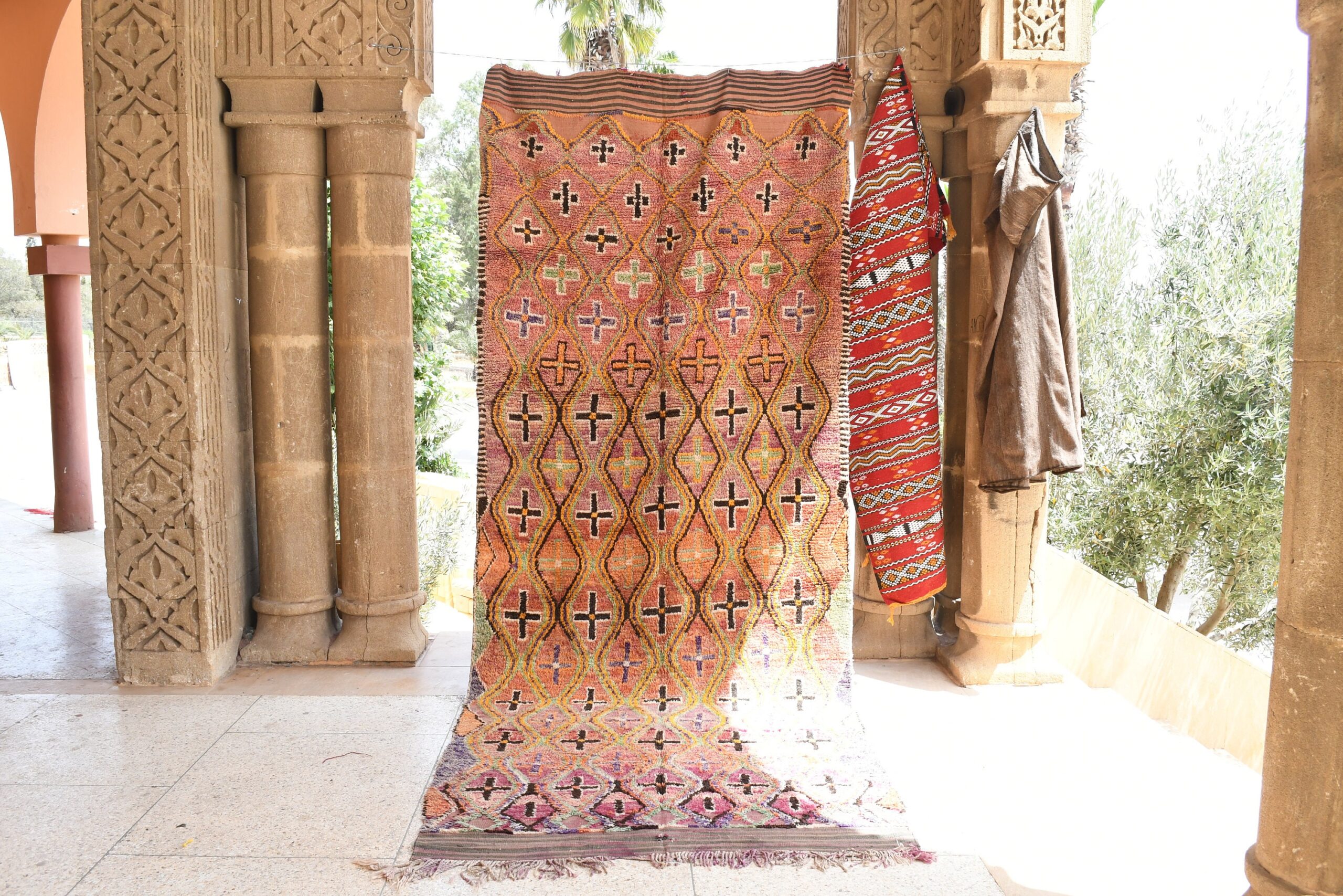 a colorful rug is hanging in a doorway. il_fullxfull.6025909520_a5kk.jpg