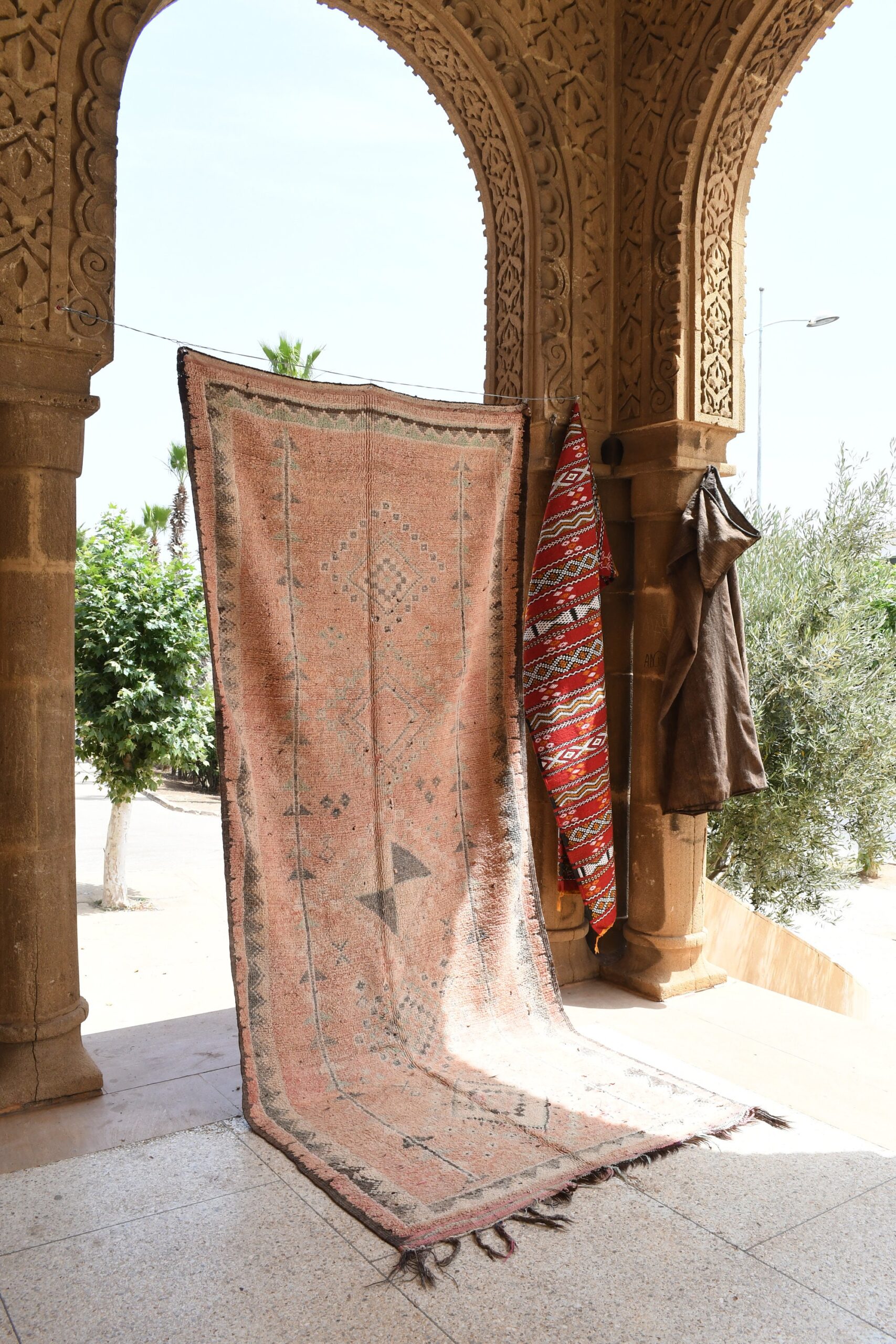 a rug hanging on a wall in a building. il_fullxfull.6025911304_iwnu.jpg