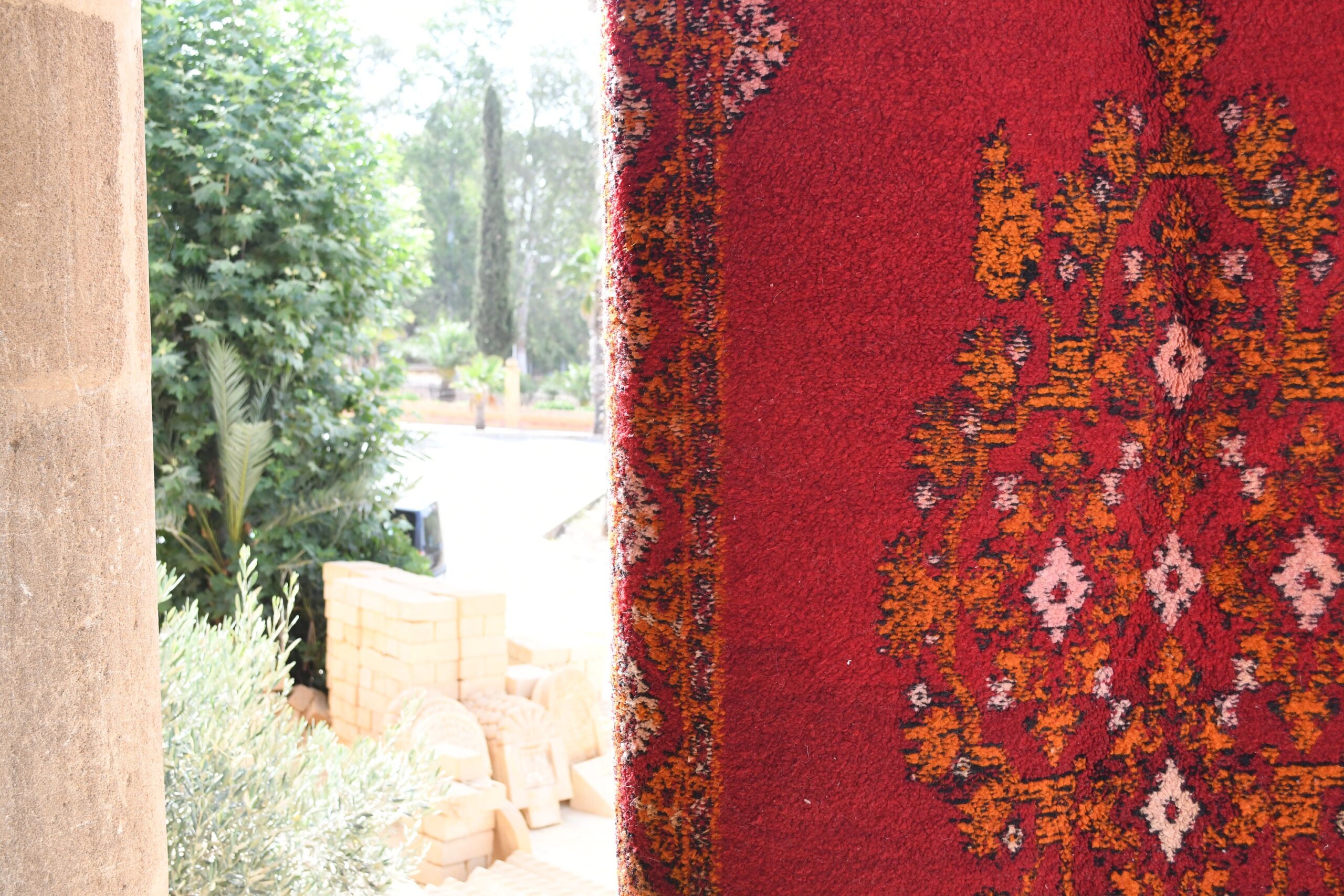 a red rug with a pattern on it. il_fullxfull.6028058296_kdhw.jpg