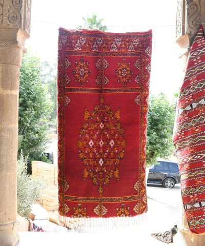 a red rug hanging on a wall. il_fullxfull.6028058676_1h1x.jpg