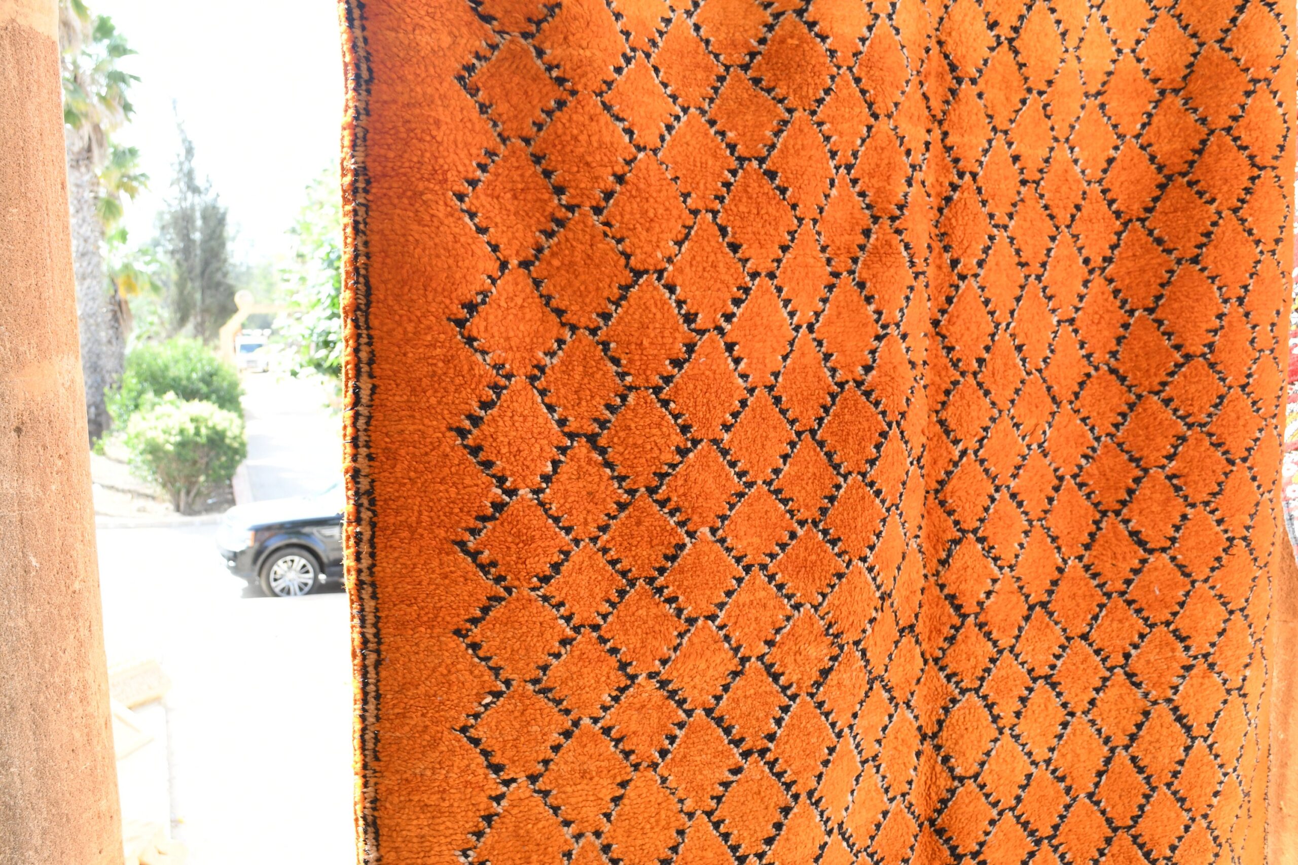 a close up of a rug on a wooden floor. il_fullxfull.6028060702_igm9.jpg