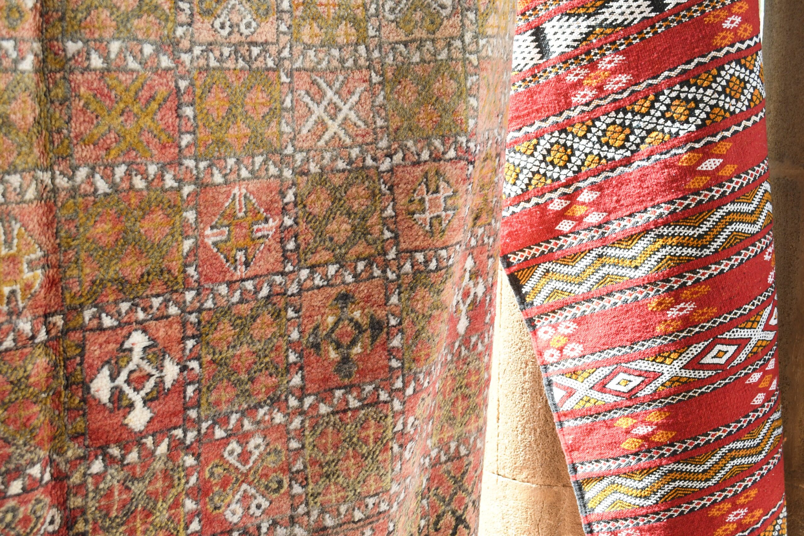 a red and yellow rug hanging on a wall. il_fullxfull.6028064514_civf.jpg