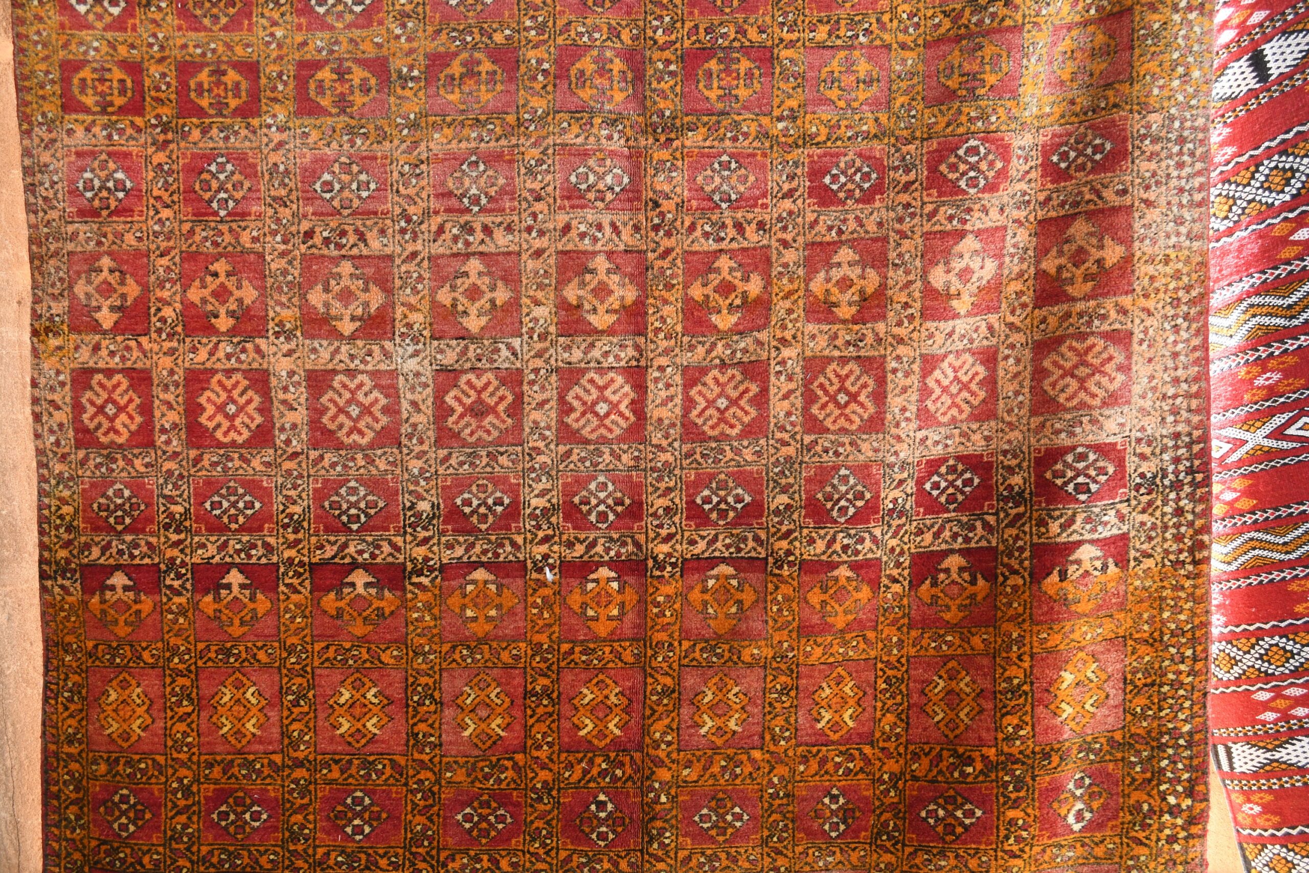 a red and gold rug with a pattern. il_fullxfull.6028067358_4wjz.jpg