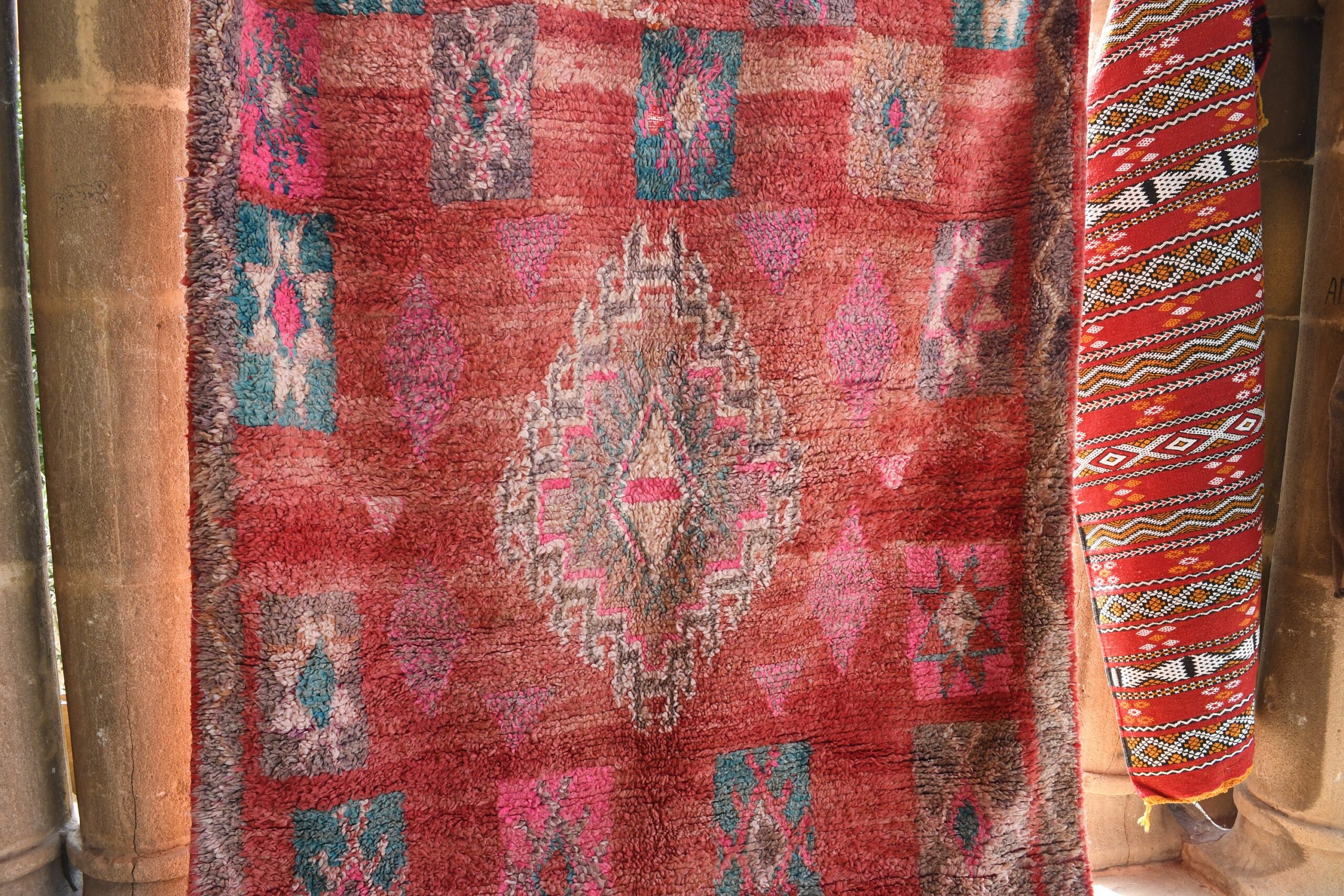 a red rug with a pattern on it. il_fullxfull.6028071686_odm0.jpg