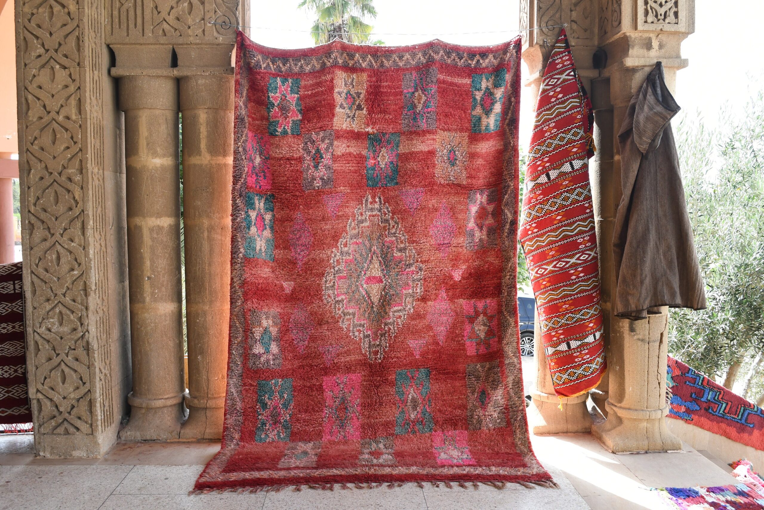 a red rug is hanging in a doorway. il_fullxfull.6028072218_15sl.jpg