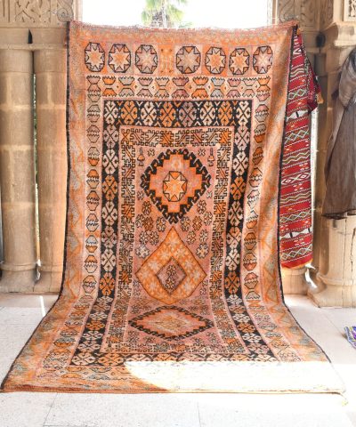 a rug is on display in a room. il_fullxfull.6028087948_9ut6.jpg