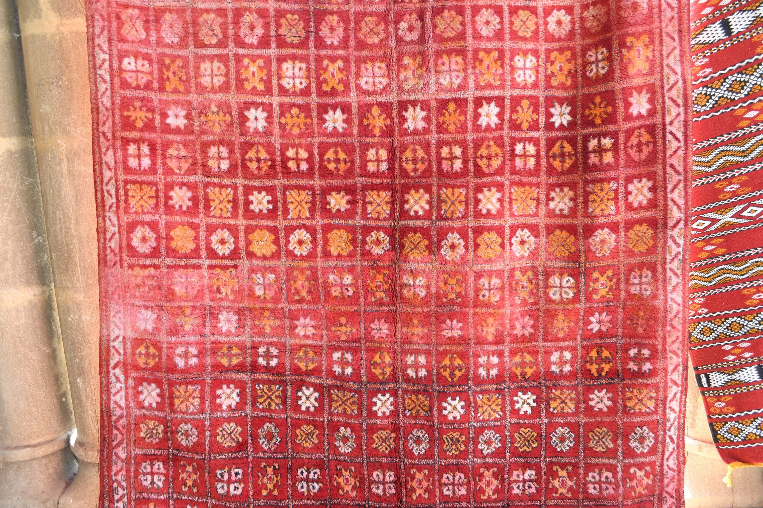 a red rug hanging on a wall. il_fullxfull.6028089064_nj5c.jpg