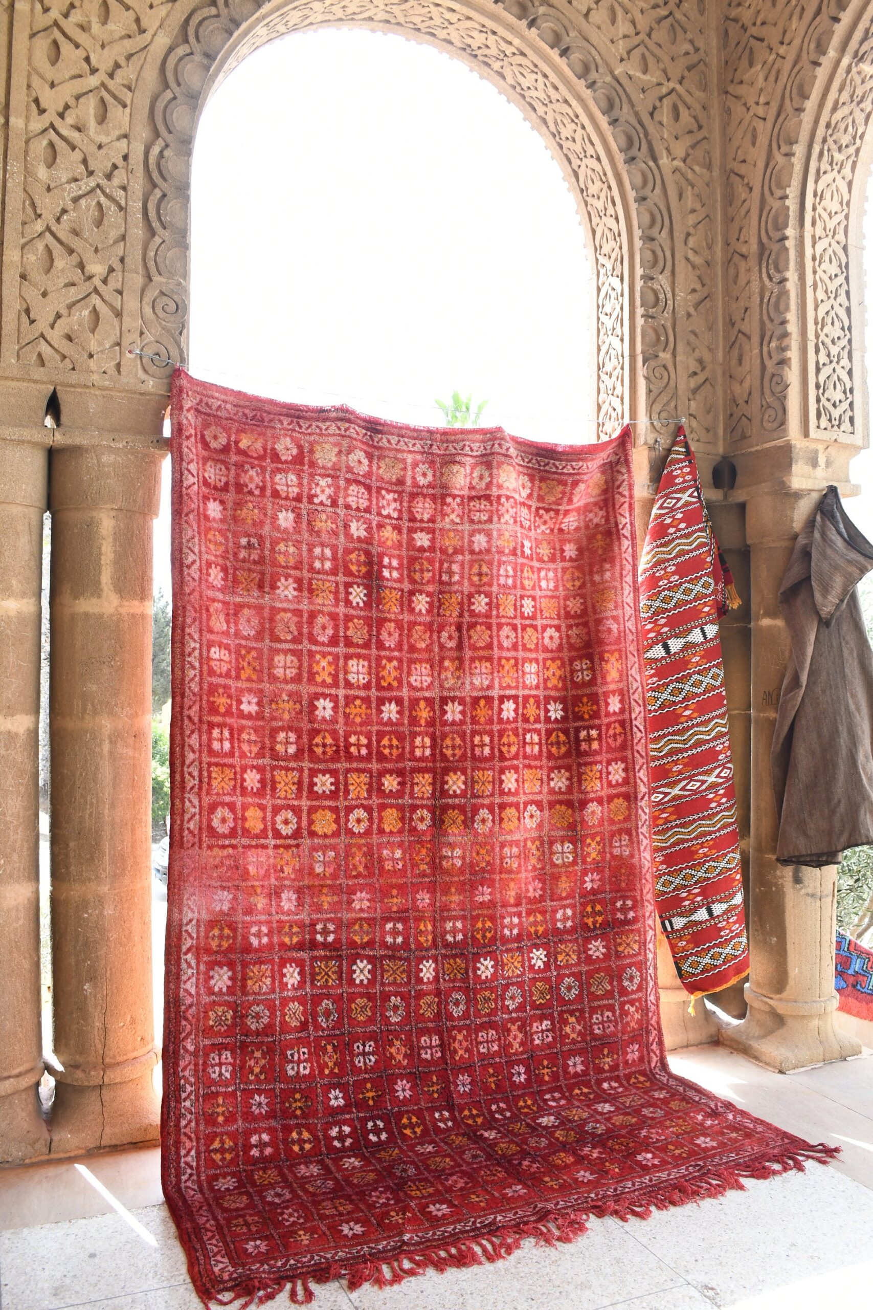 a red rug hanging on a wall. il_fullxfull.6028089192_p59s.jpg