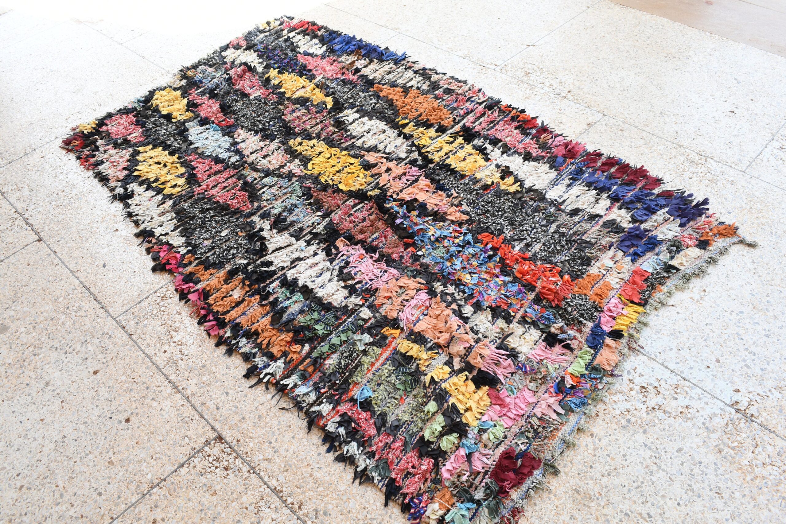 a rug with a colorful pattern on it. il_fullxfull.6028097320_hdun.jpg