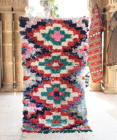 a colorful rug is hanging on a wall. il_fullxfull.6028100512_ps5n.jpg