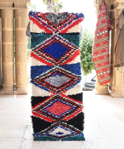 a tall colorfully decorated column. il_fullxfull.6028101758_4c9r.jpg