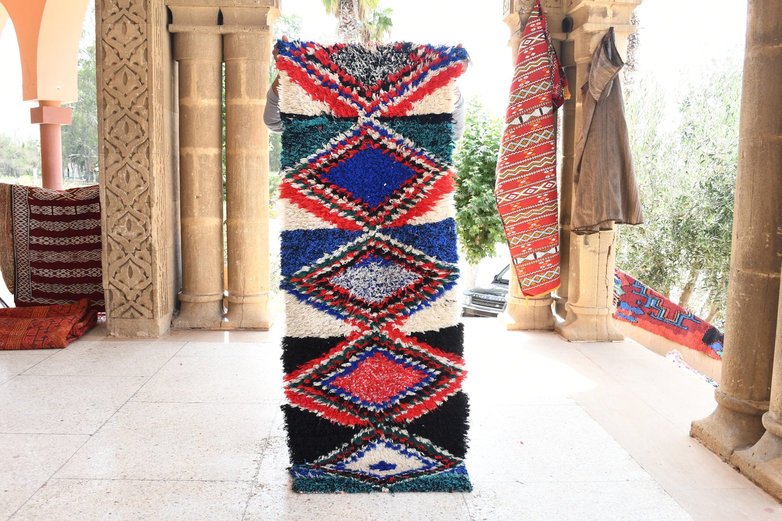 a tall colorfully decorated column. il_fullxfull.6028101758_4c9r.jpg