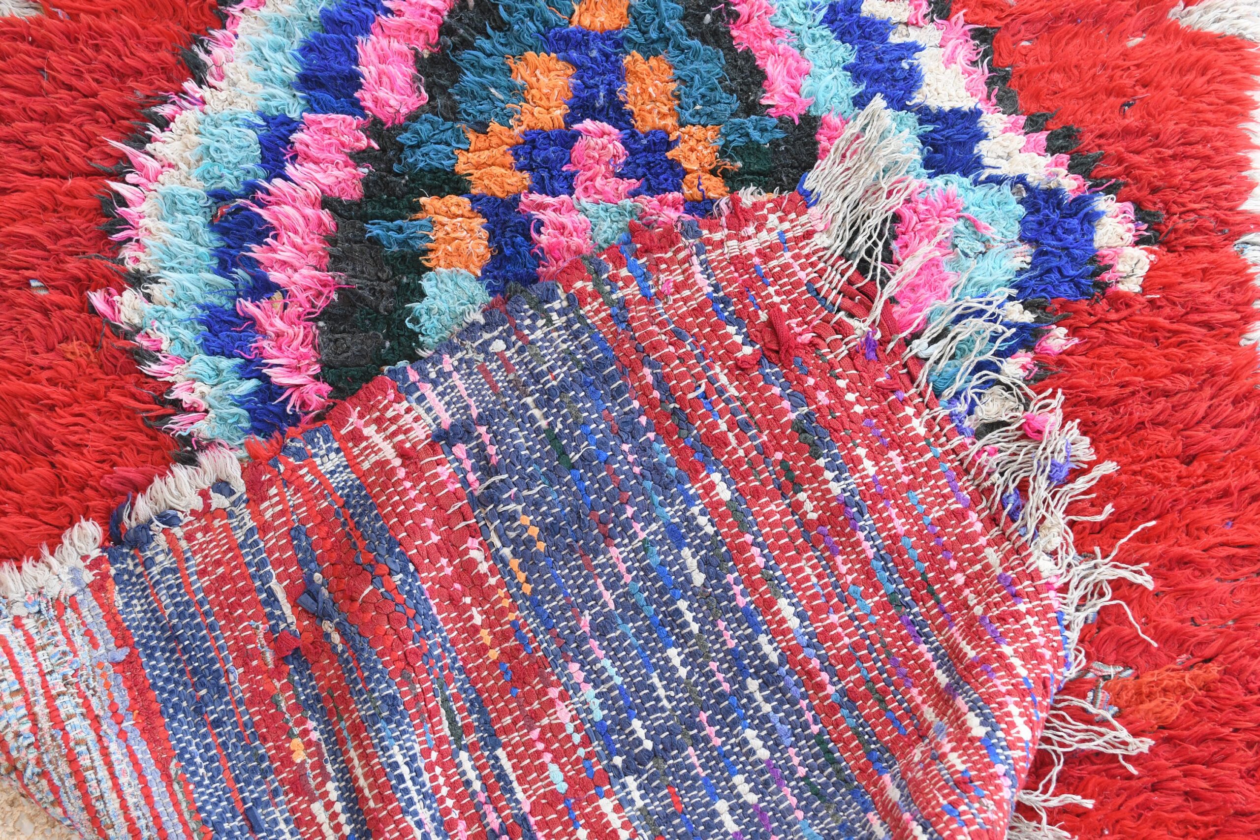 a red rug with a bunch of flowers on it. il_fullxfull.6028103294_a9fr.jpg