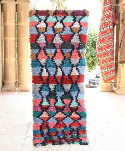 a colorful rug is on display in a room. il_fullxfull.6028110286_p9oe.jpg