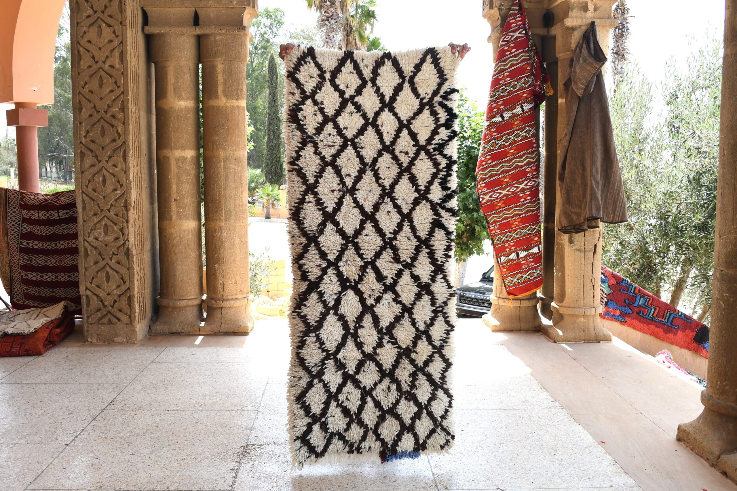 a large rug is hanging on a wall. il_fullxfull.6028114638_e7yf.jpg