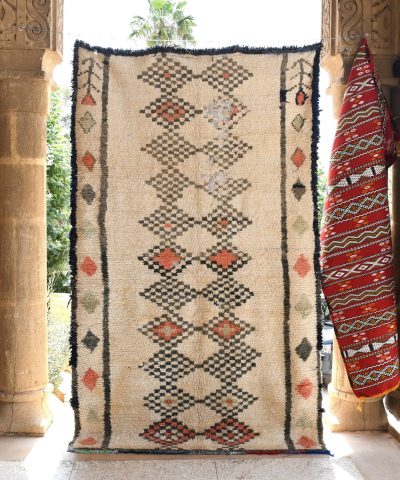 a rug hanging on a wall in a room. il_fullxfull.6028119690_4060.jpg