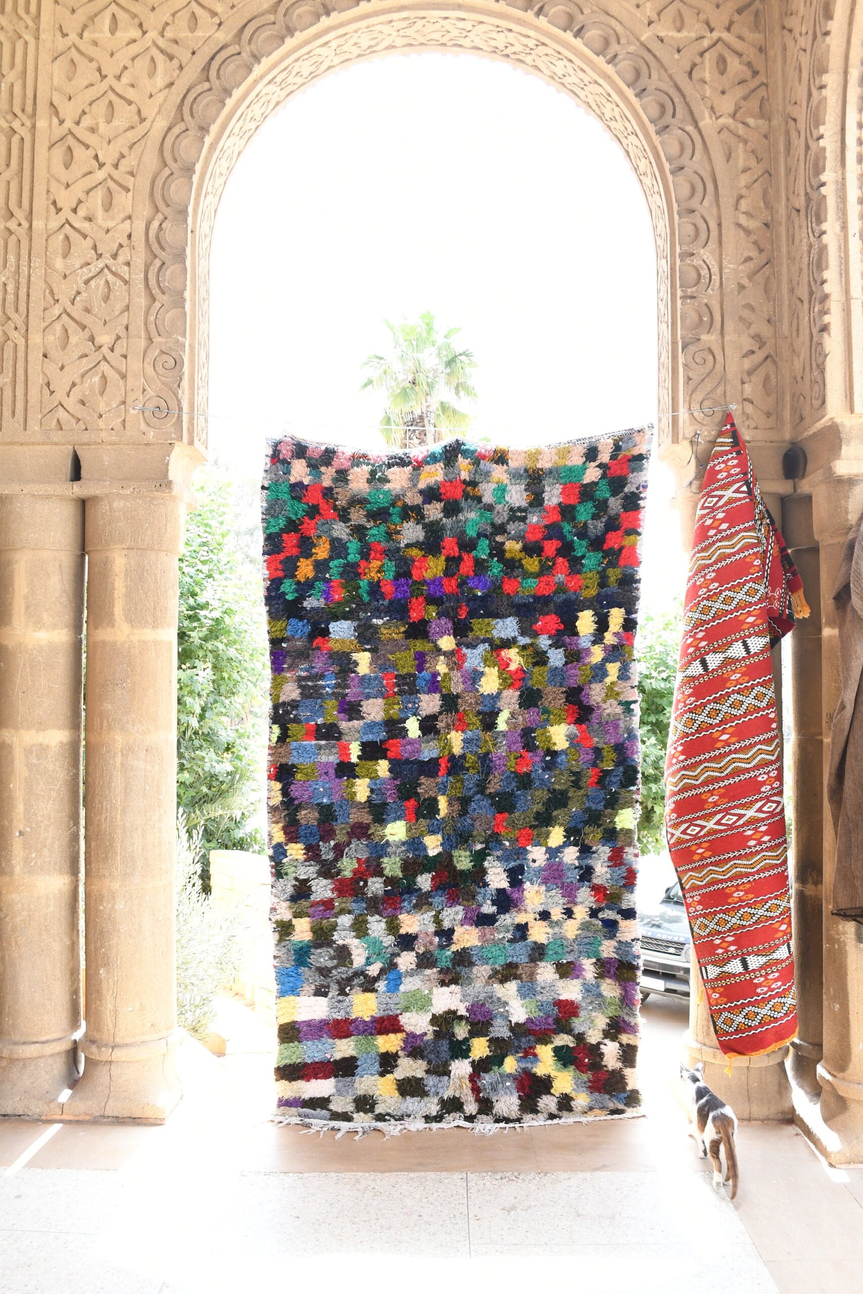 a colorful rug hanging on a wall. il_fullxfull.6028122624_cqal.jpg