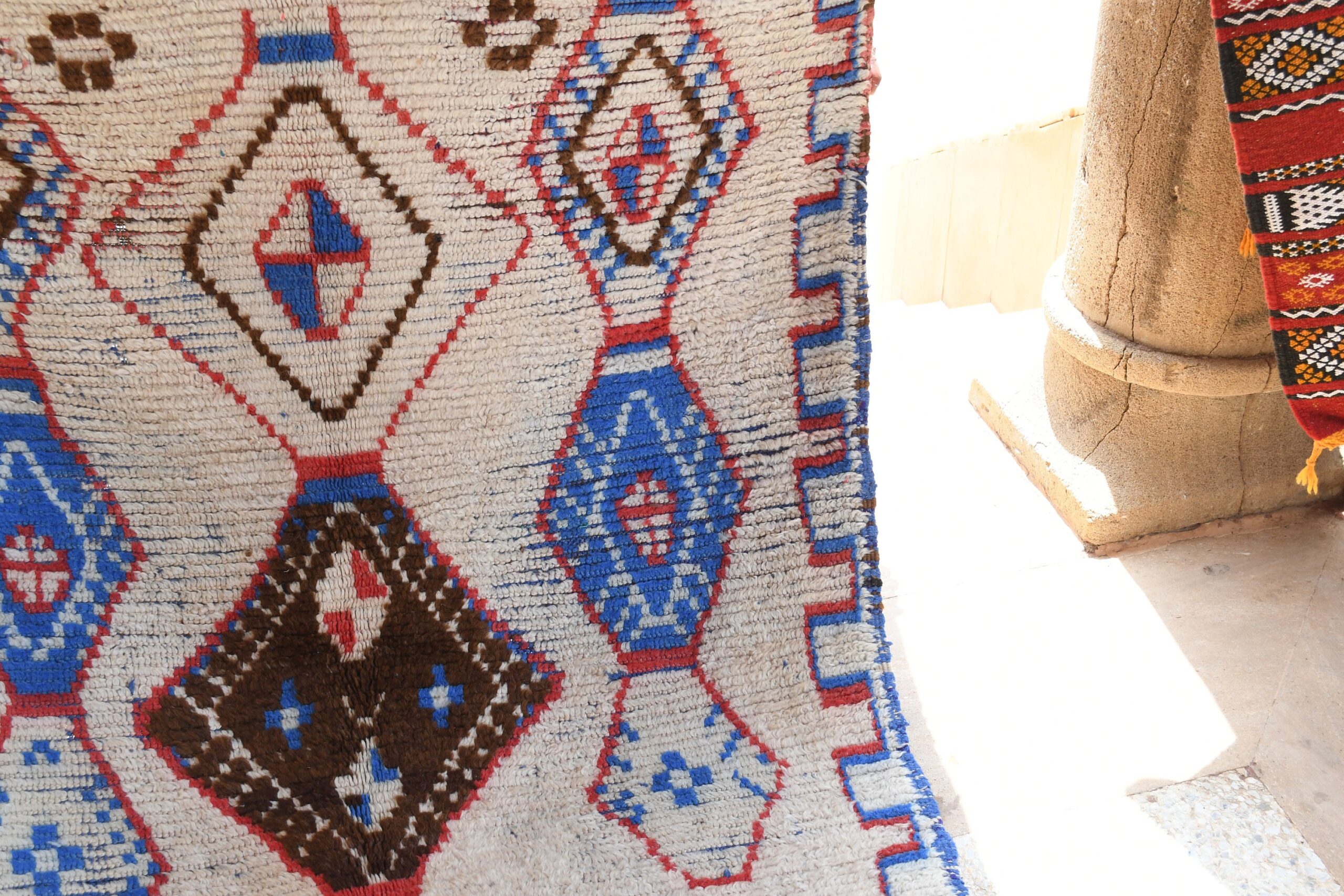 a rug hanging on a wall. il_fullxfull.6028125166_7ilf.jpg