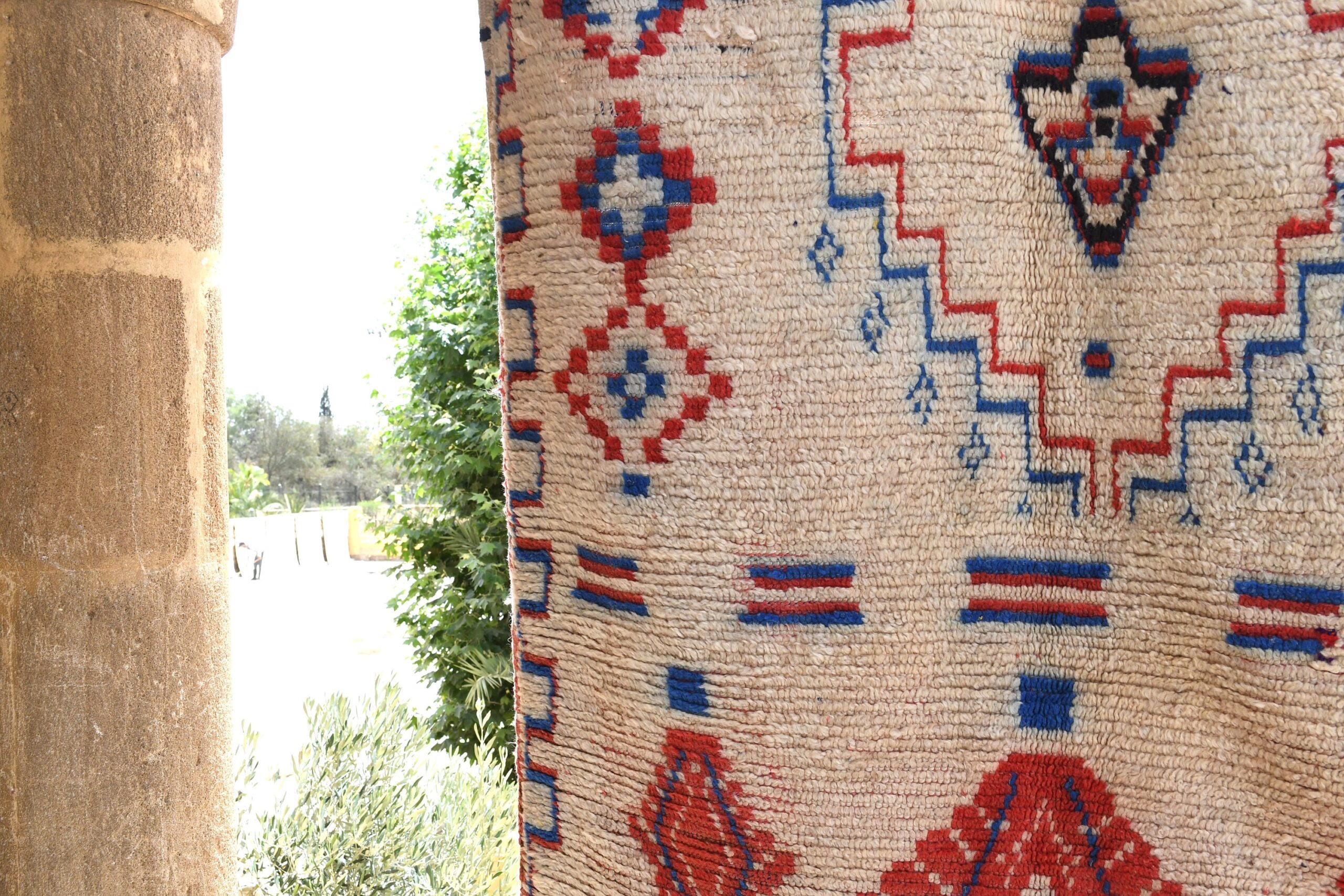 a rug hanging on a wall. il_fullxfull.6028125284_rr5c.jpg