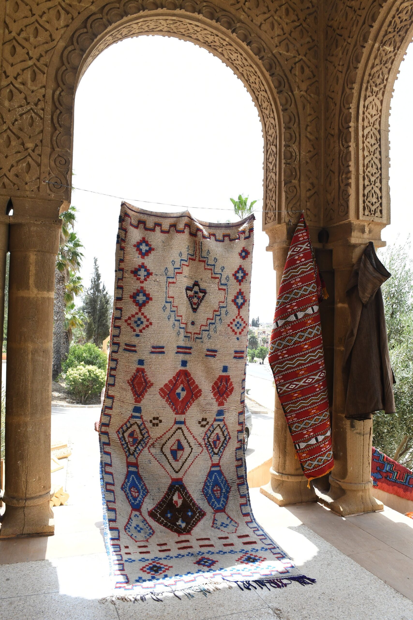 a large rug on display in a building. il_fullxfull.6028125546_28hg.jpg