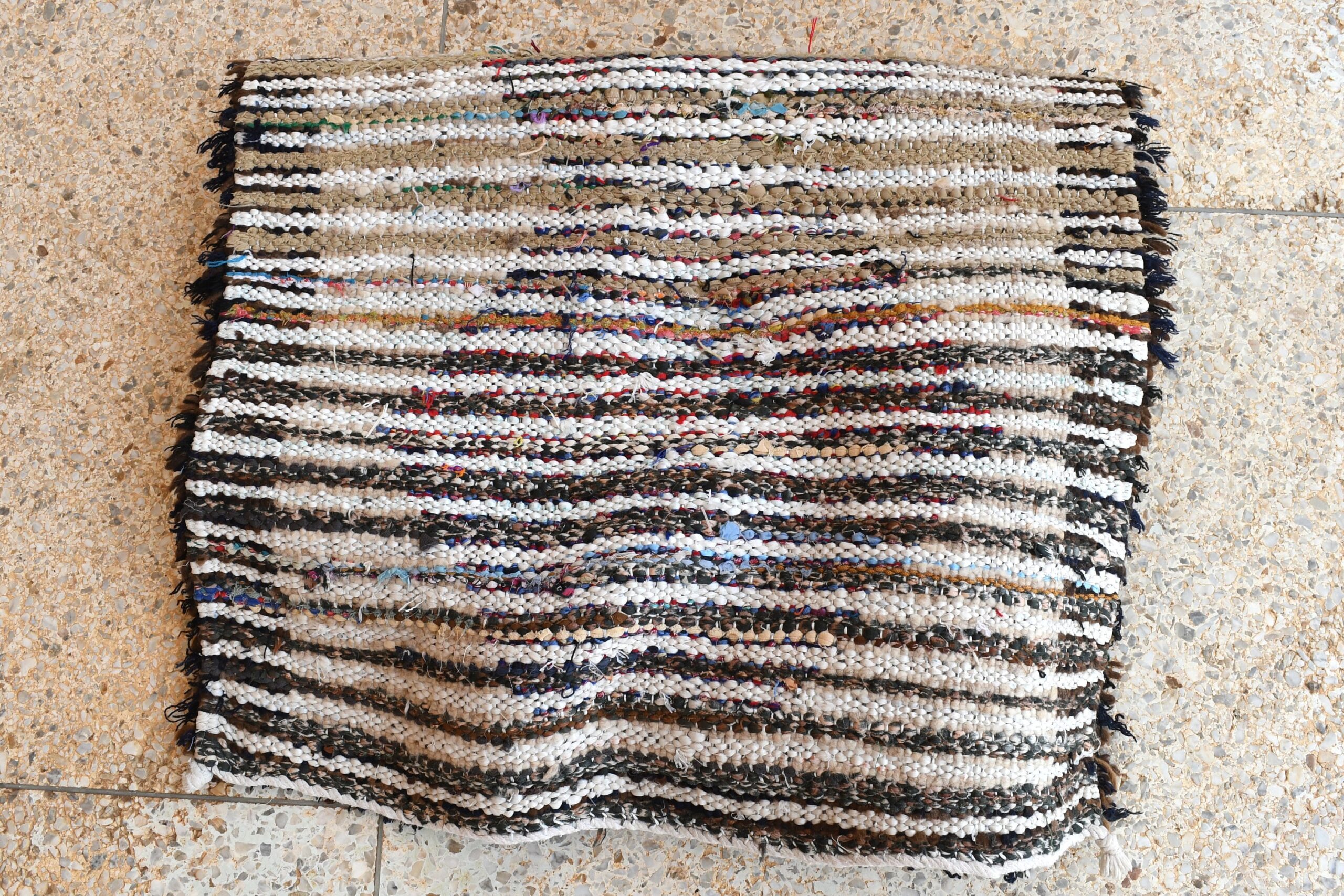 a knitted moroccan rug on the floor. il_fullxfull.6028128172_gnnu.jpg