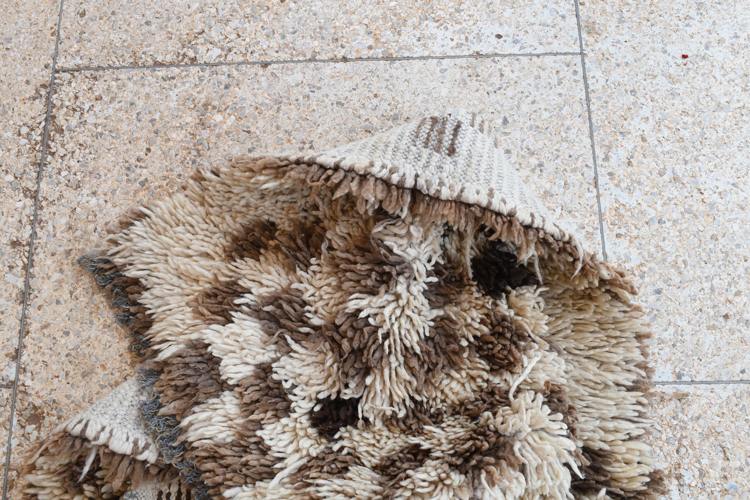 a pile of dirty rugs on the floor. il_fullxfull.6028204922_rcpd.jpg