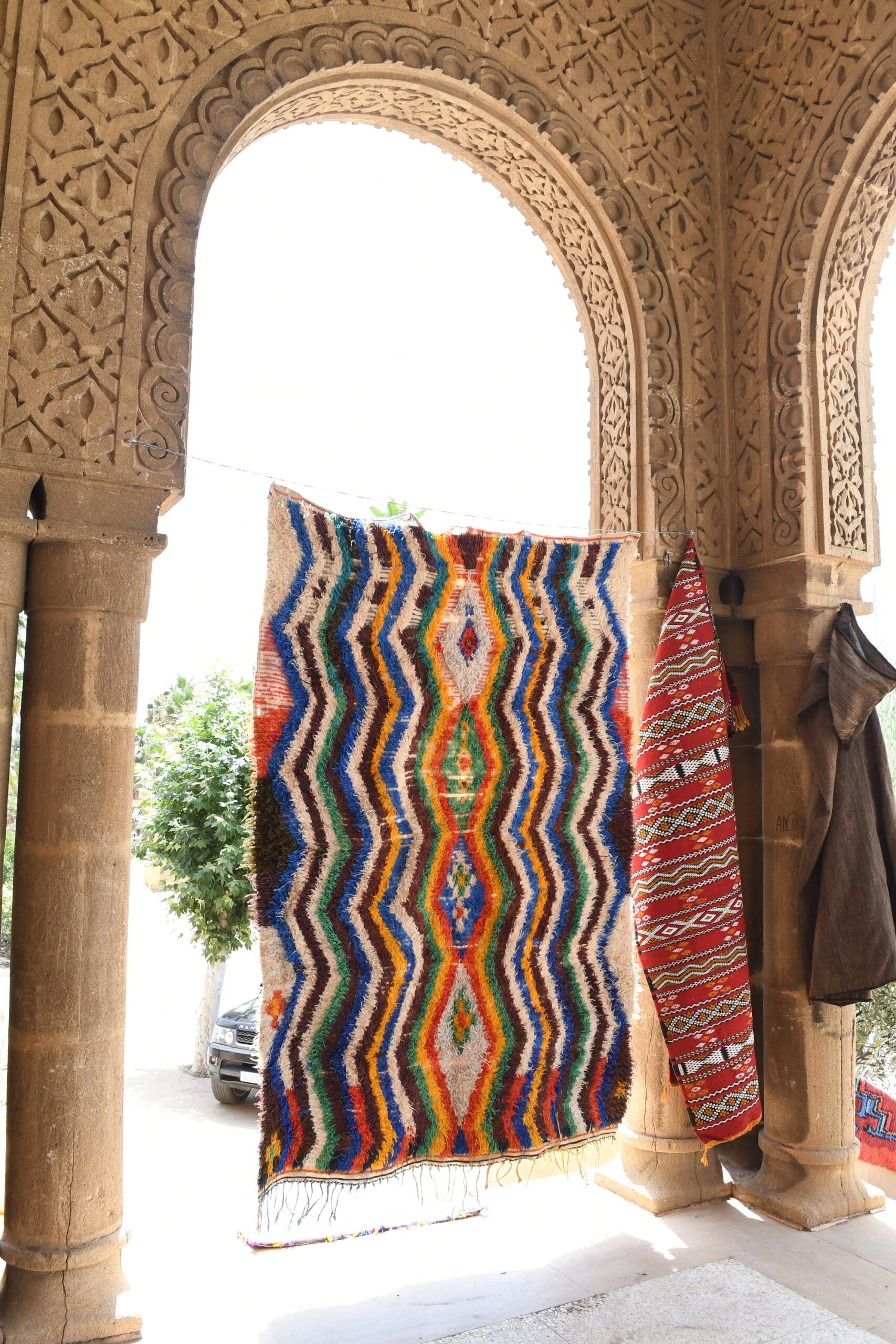 a colorful rug hanging on a wall. il_fullxfull.6028207924_j0n0.jpg