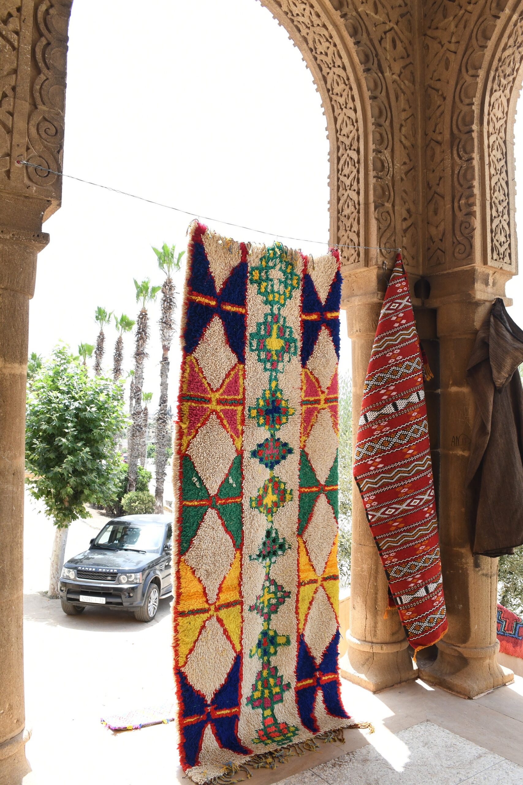 a colorful rug hanging on a wall. il_fullxfull.6028209512_67k1.jpg