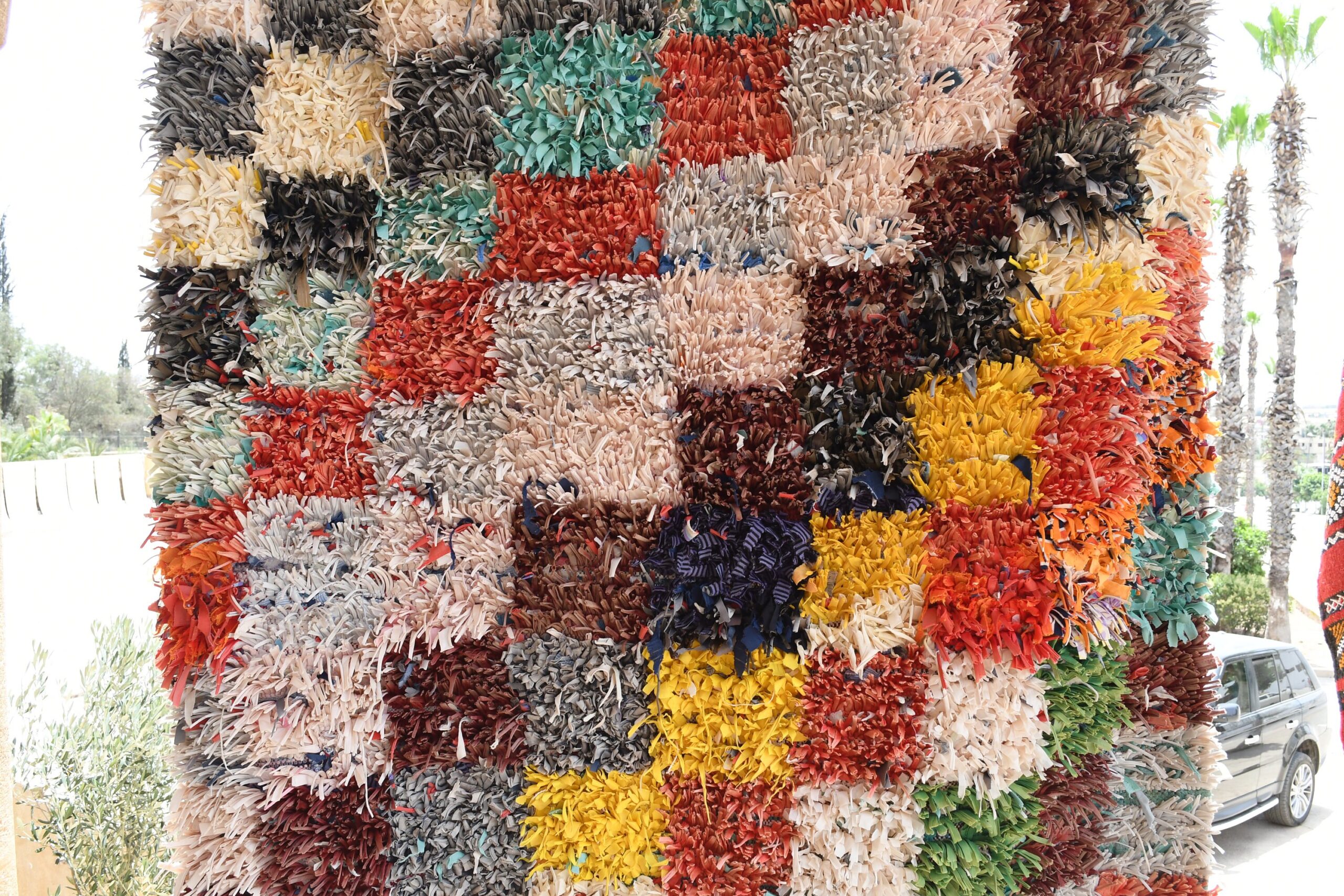 a large pile of colorful rugs on display. il_fullxfull.6028211010_ftuz.jpg