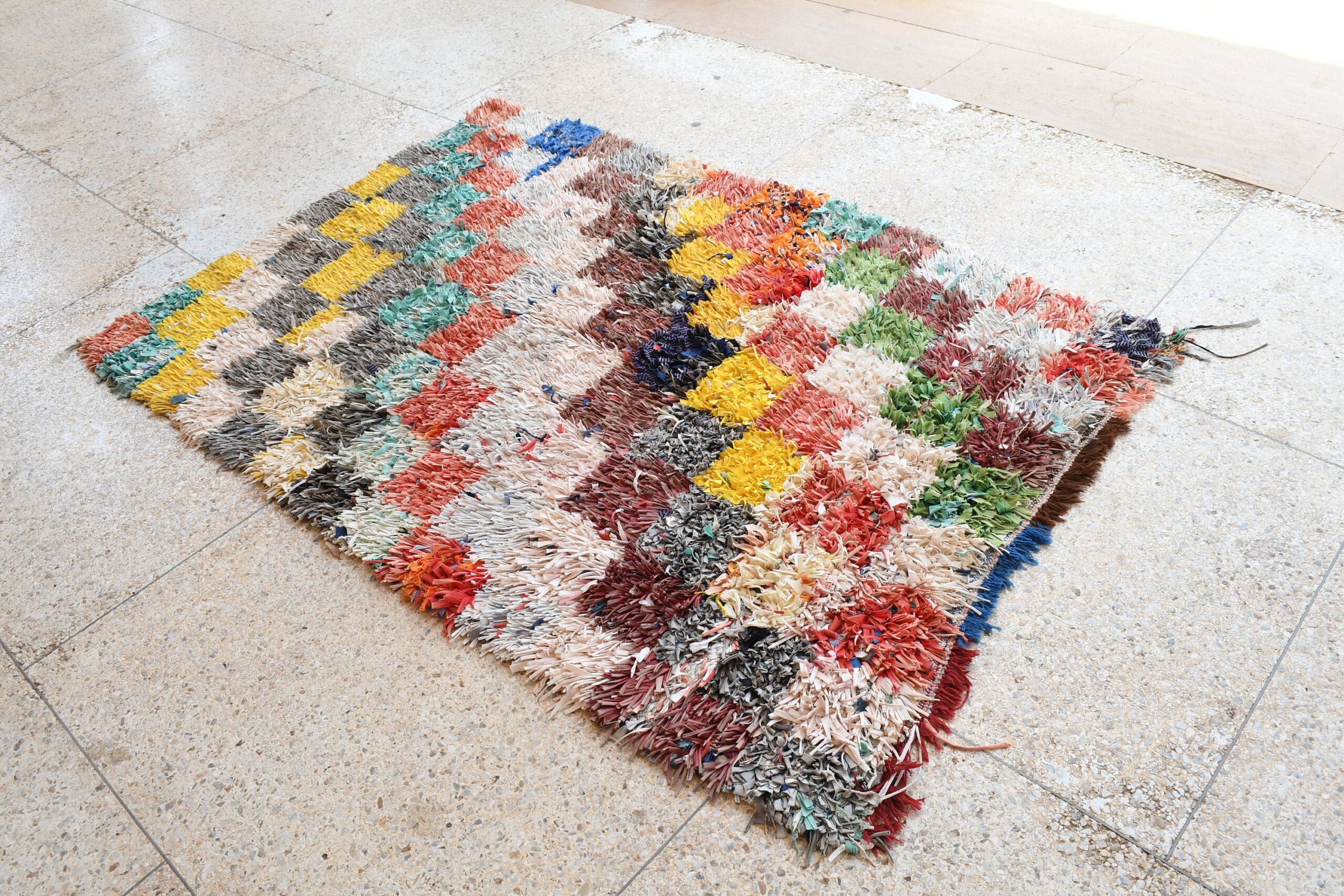 a rug with a colorful pattern on the floor. il_fullxfull.6028211368_e614.jpg