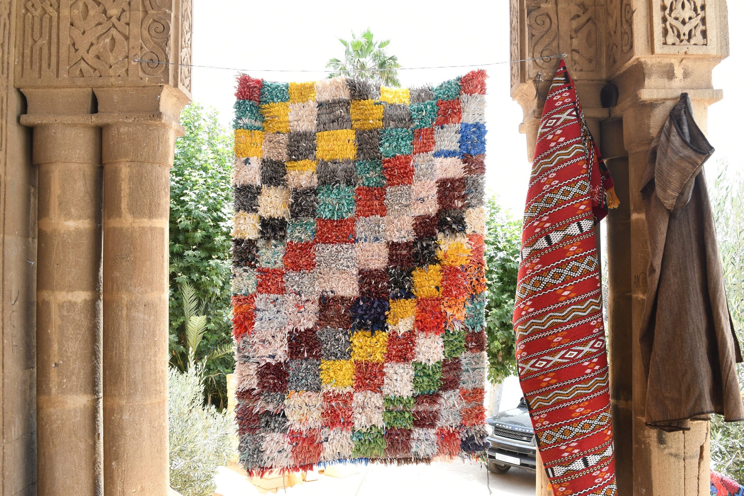 a colorful rug hanging on a wall. il_fullxfull.6028211624_qrhl.jpg