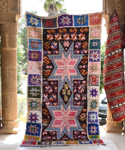 a colorful rug hanging on a wall. il_fullxfull.6028213222_sxdj.jpg