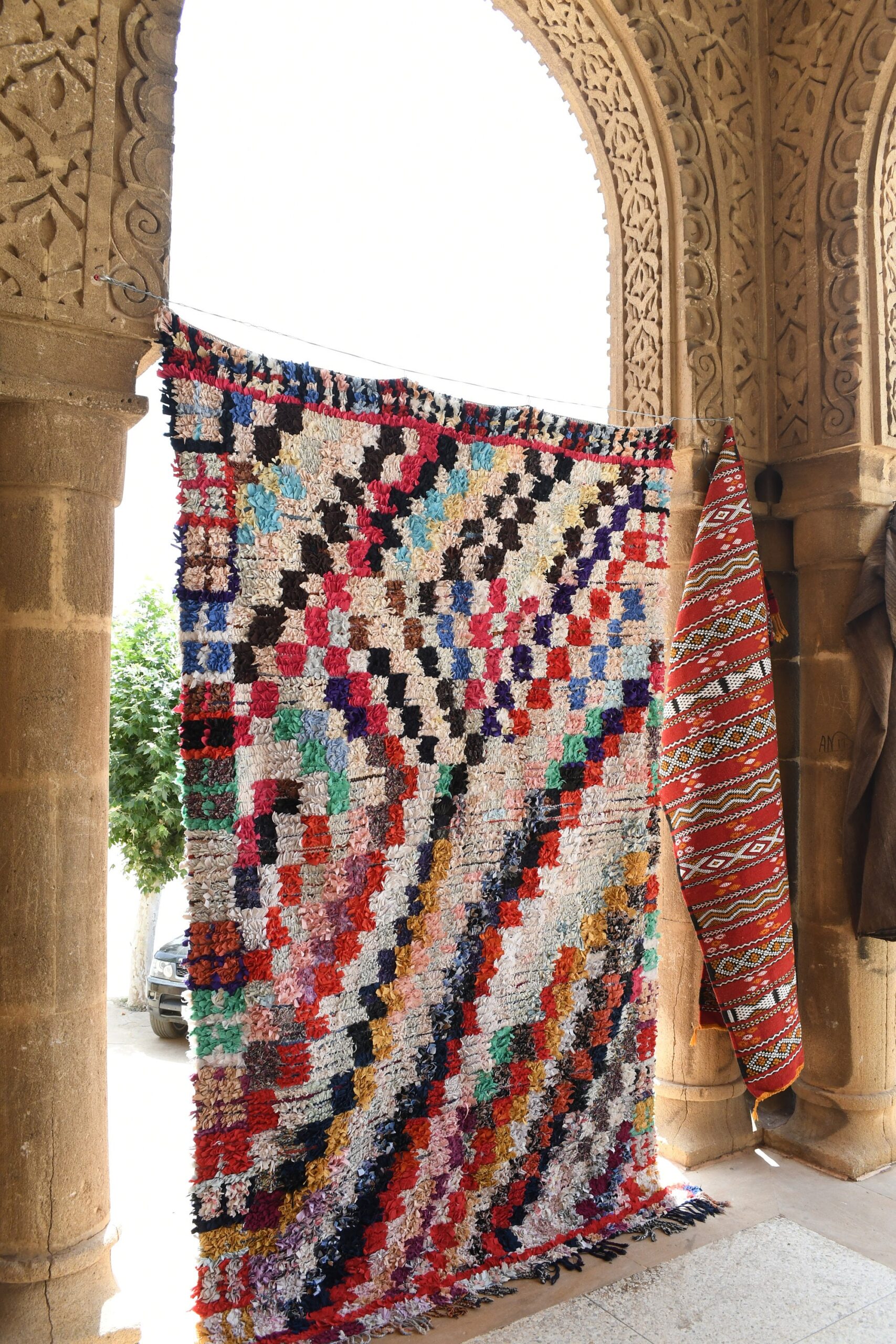 a colorful rug hanging on a wall. il_fullxfull.6028214426_dx8i.jpg