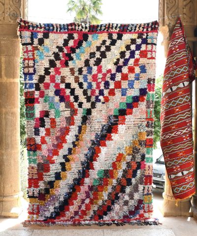 a colorful rug hanging on a wall. il_fullxfull.6028214788_etz8.jpg