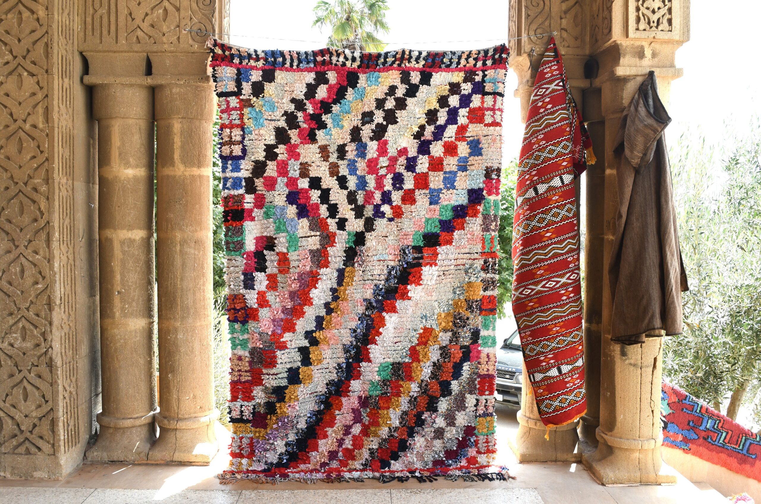 a colorful rug hanging on a wall. il_fullxfull.6028214788_etz8.jpg