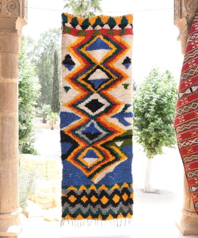 a colorfully decorated area with a large rug. il_fullxfull.6028218144_6pky.jpg