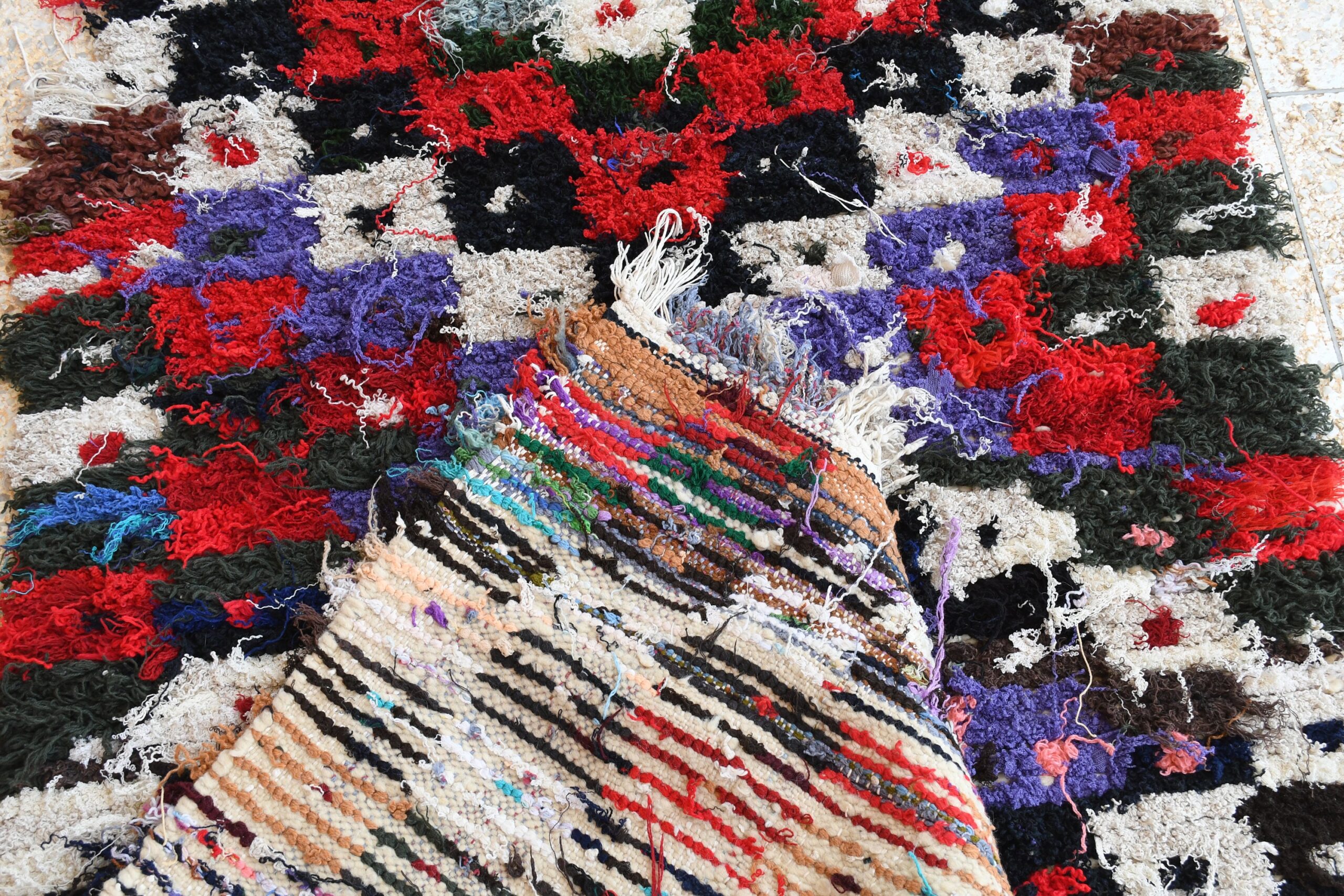 a pile of colorful rugs with a bunch of flowers. il_fullxfull.6028227326_sjvn.jpg